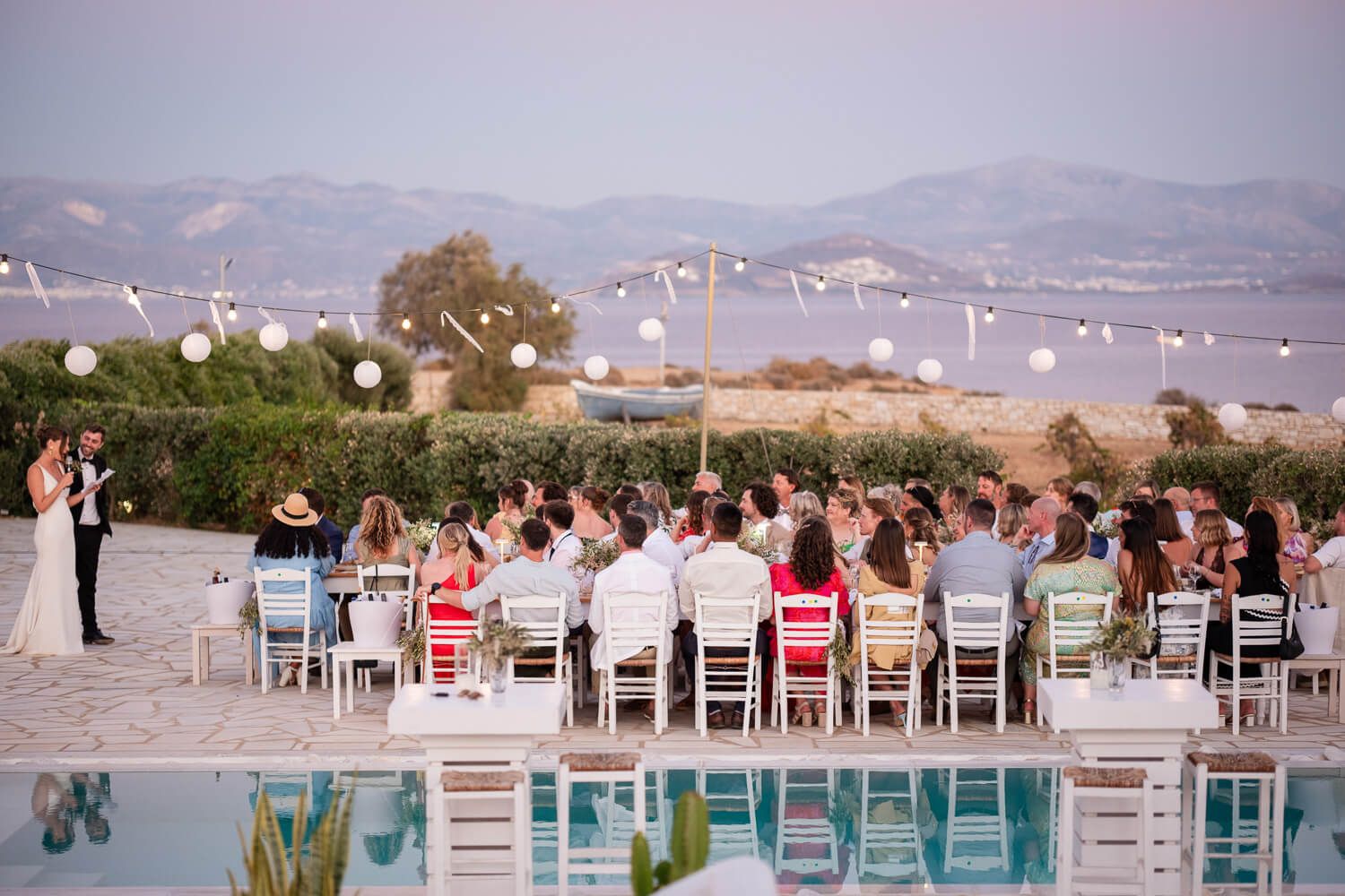 Elegant poolside wedding dinner setup at Villa Virginia Paros