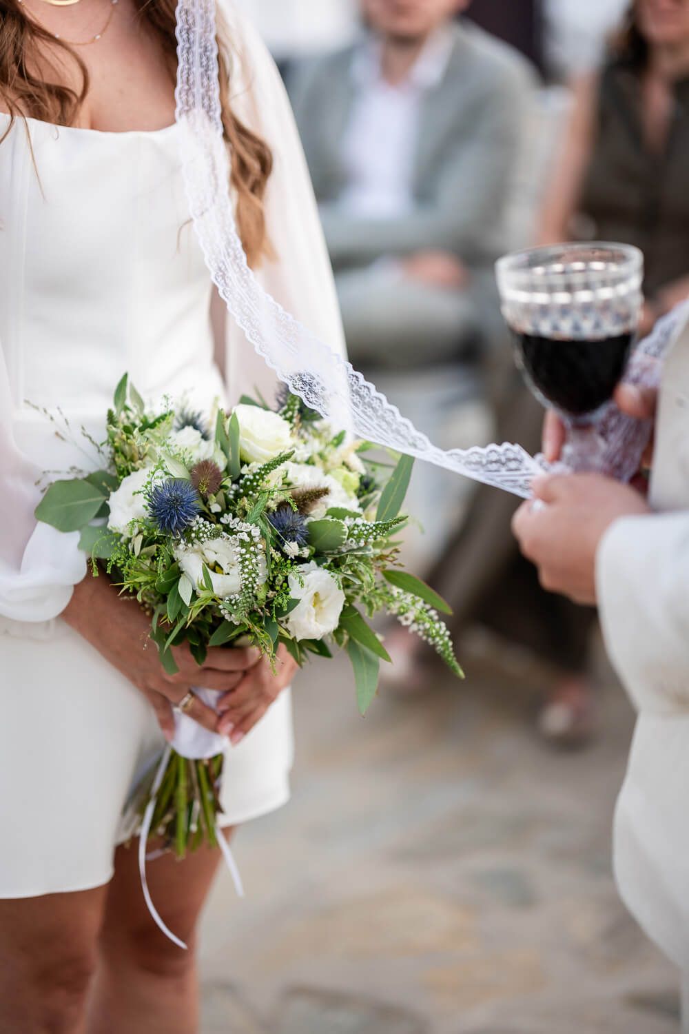 The couple sharing wine from a common cup, a beautiful Greek wedding tradition