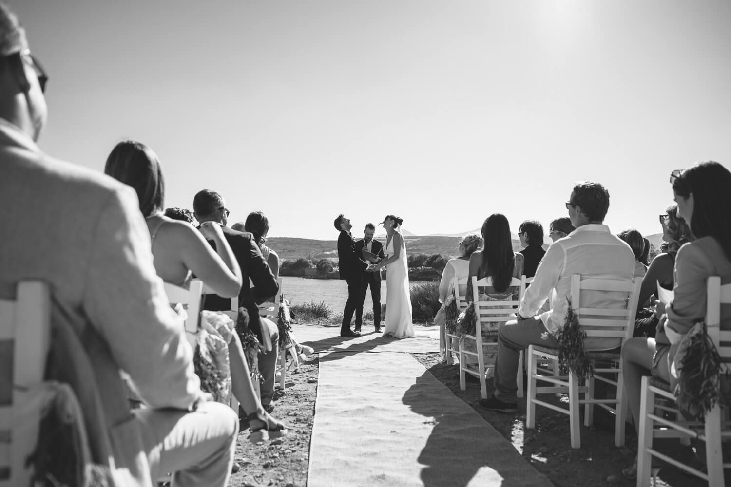 Custom wedding ceremony setup on the coastal rocks of Ambelas, Paros