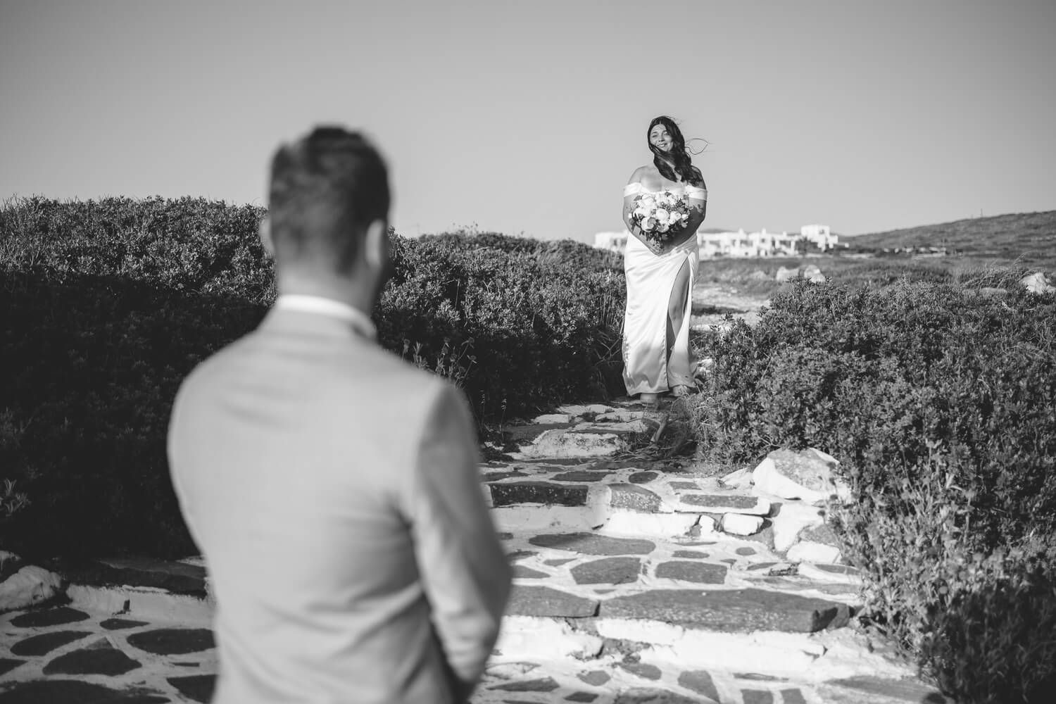 Groom waiting for the bride to come at a hilltop chapel in Paros
