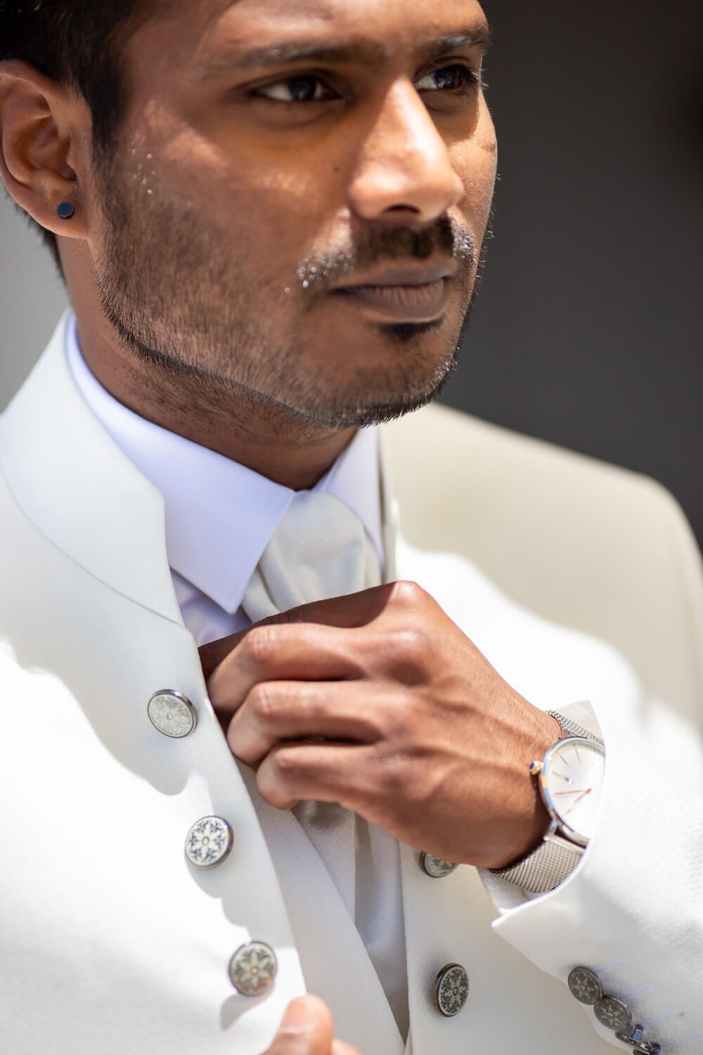 Details of the groom's elegant attire for his Paros destination wedding