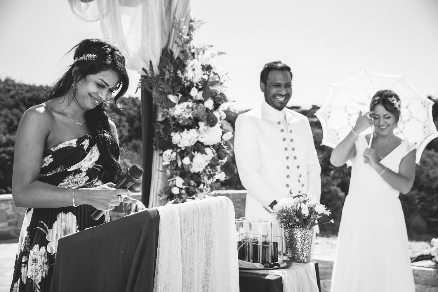 Couple loughing during their symbolic wedding ceremony at Pyrgaki Paros