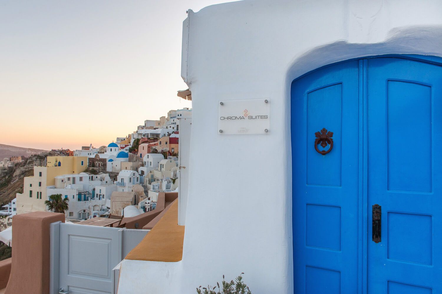 Vibrant exterior details inspired by the world-renowned Oia sunset