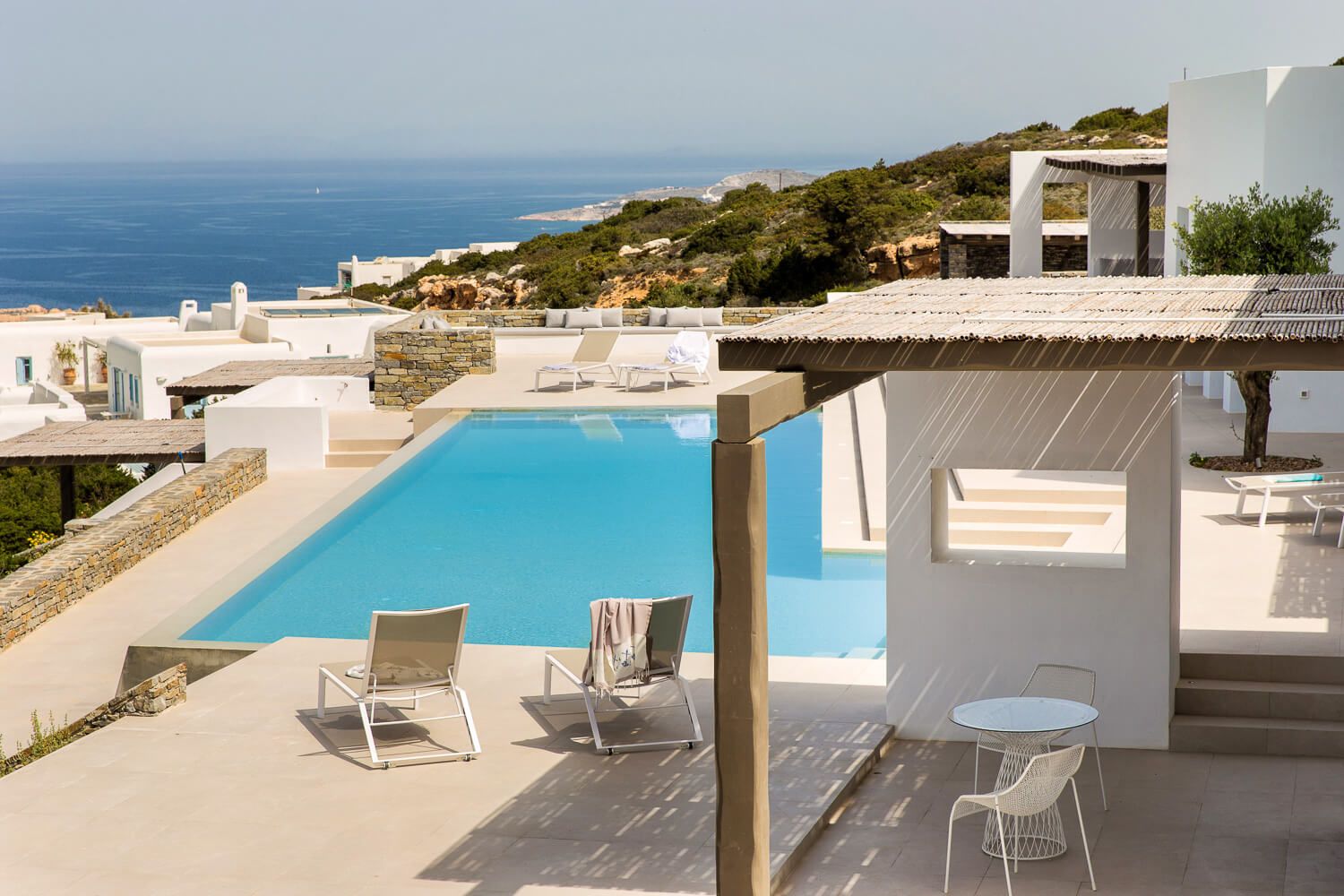 Contemporary exterior lounge setups with breathtaking Greek sea views