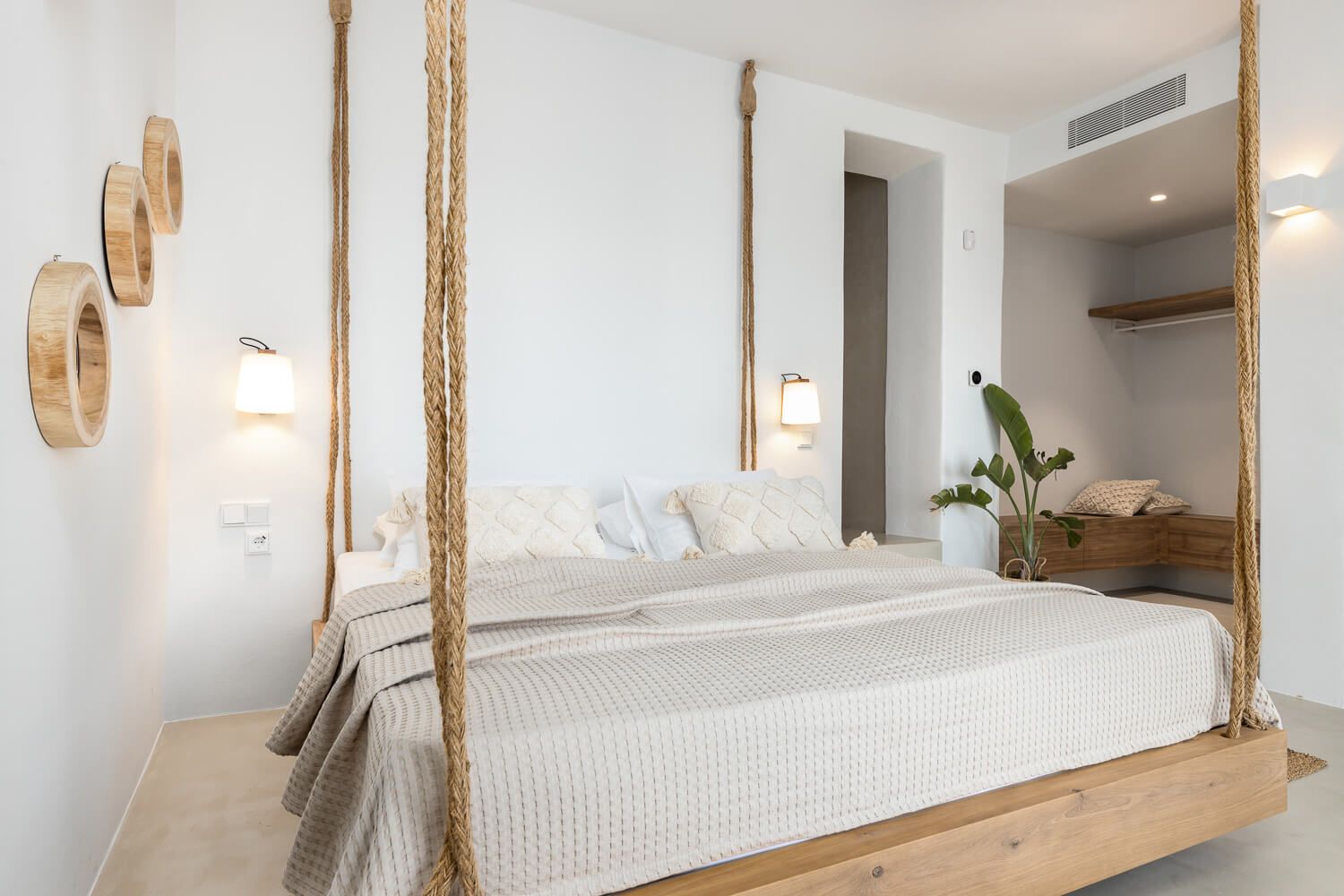 Crisp linen textures and premium bedding in a luxury suite