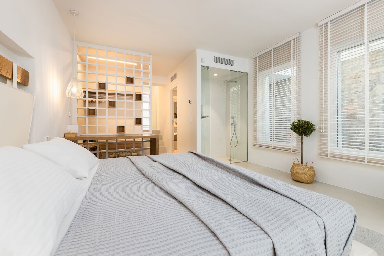 Distinctive bedroom styling focusing on warmth at a luxury villa in Paros