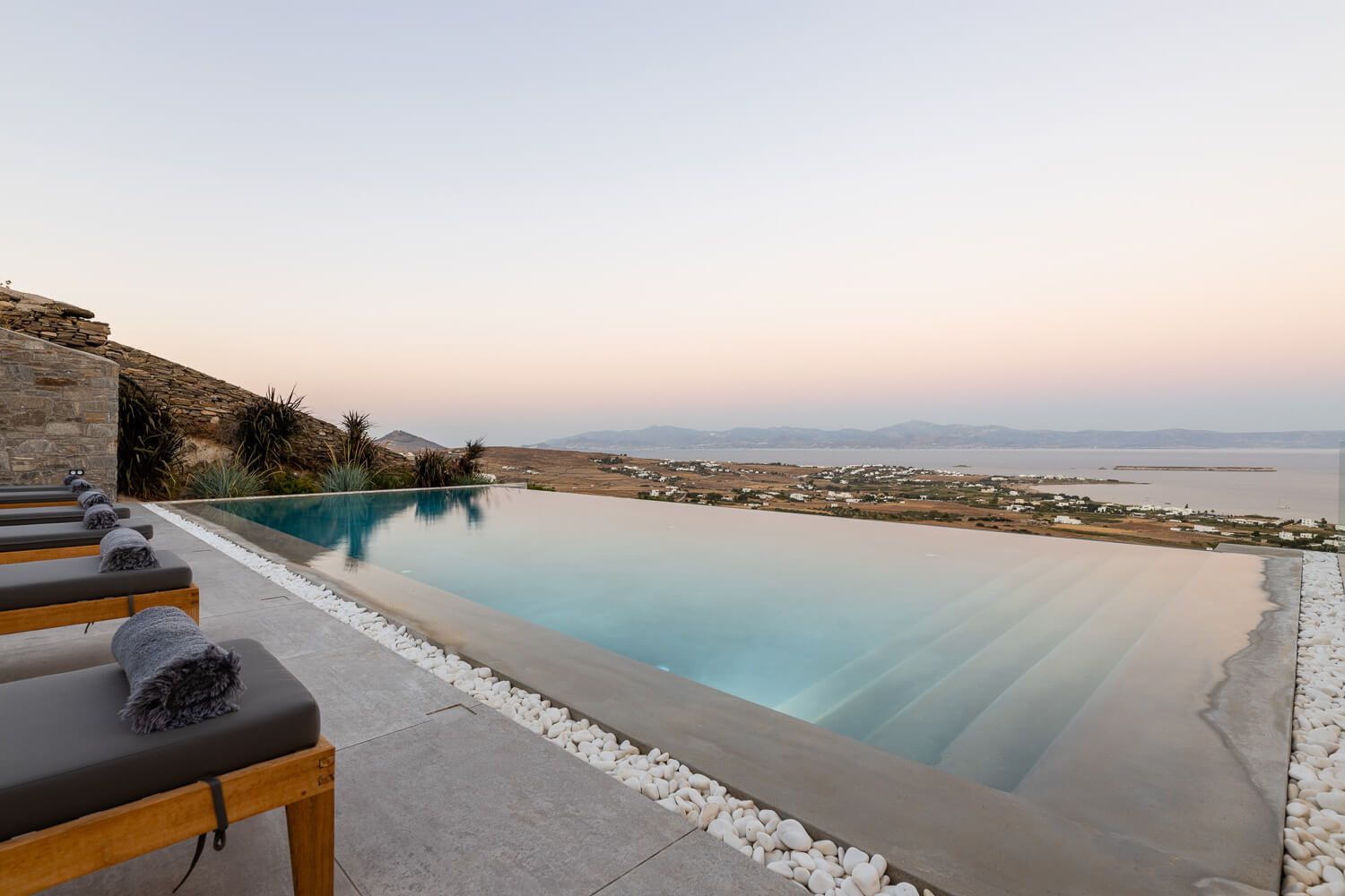 Framing the serene landscape of southeastern Paros at dusk