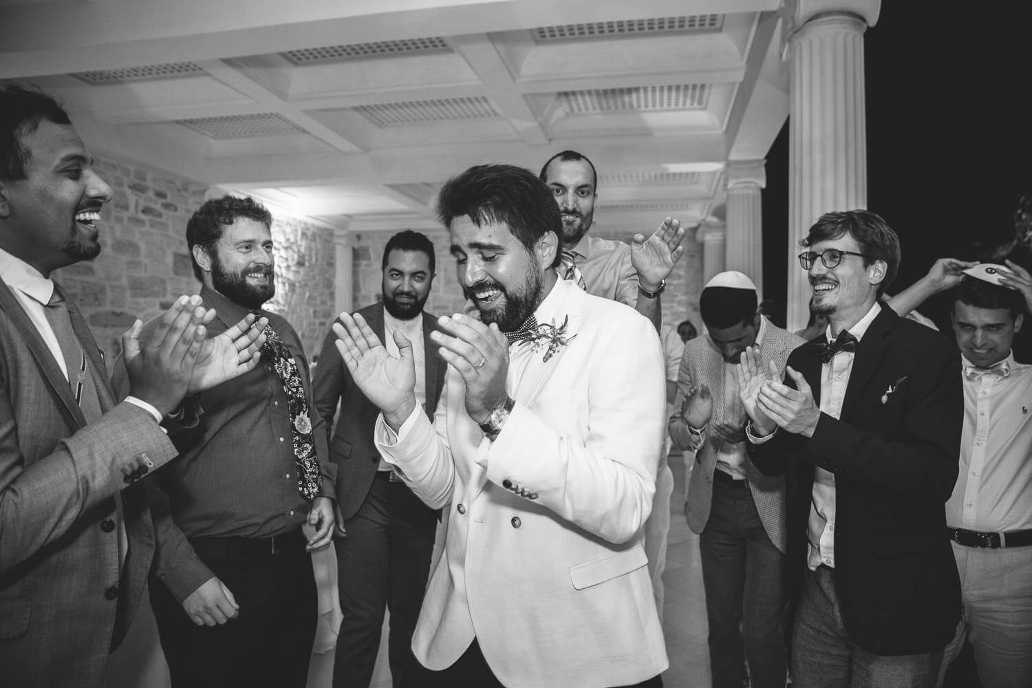 Jewish wedding party at night under the stars in Villa Aethra