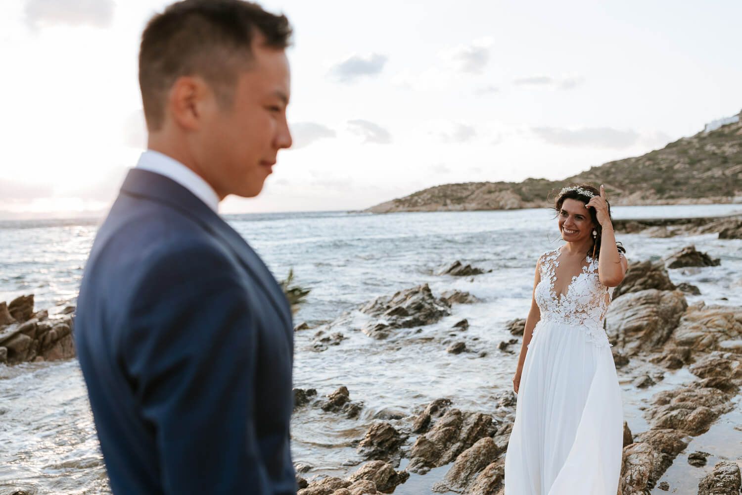 Couple walking on the beach after their wededing ceremony in Agios Georgios Antiparos