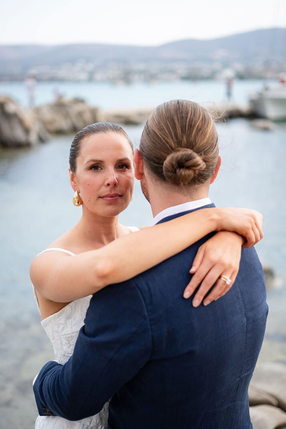 Intimate moment between bride and groom at a Cyclades destination wedding