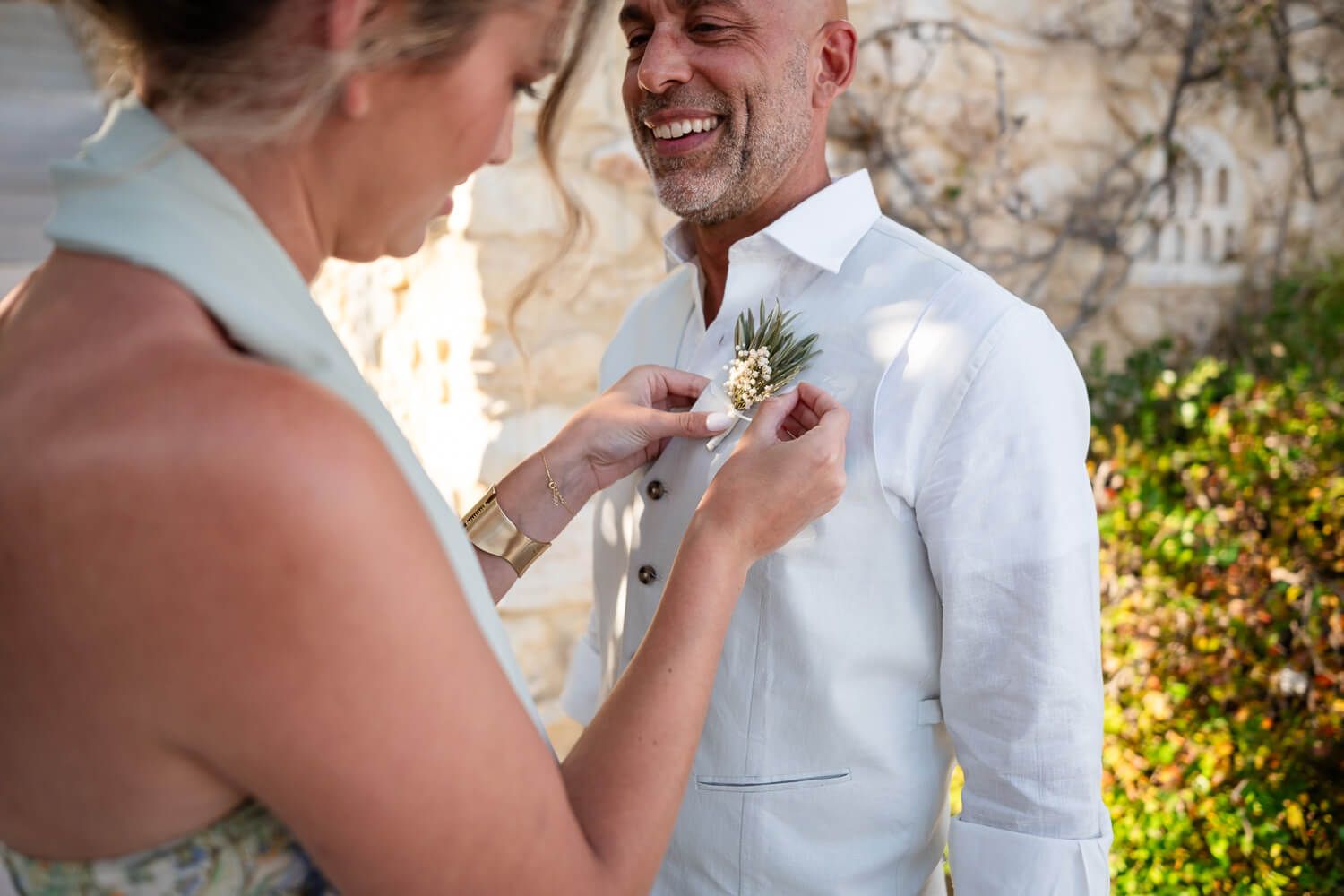 Groom Dean getting ready for his small wedding celebration in Greece