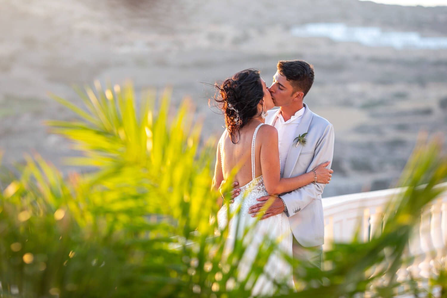 Couple kissing during an Italian wedding at Villa Aethra Paros