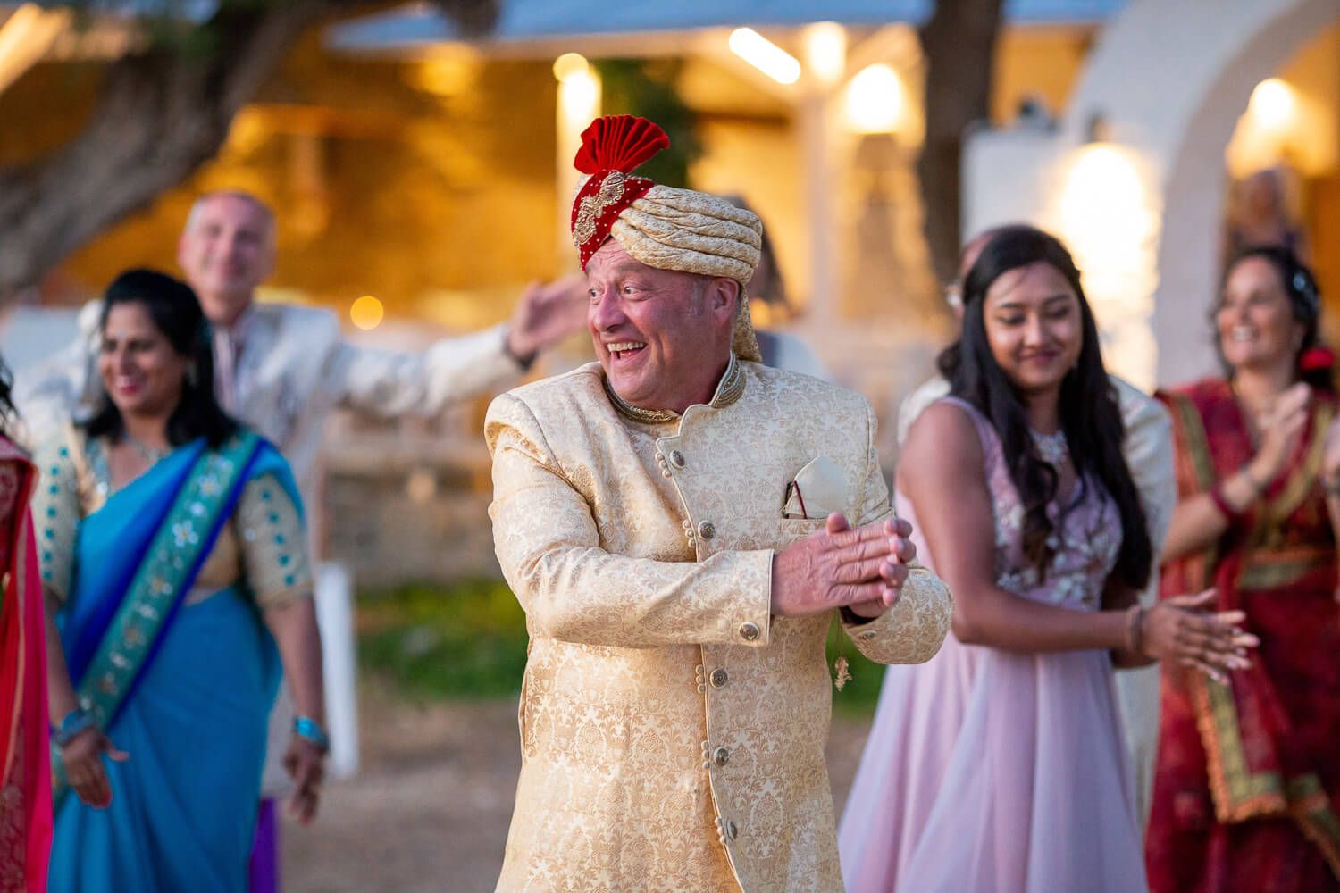Guests dancing outside Thalassamou restaurant before the wedding dinner