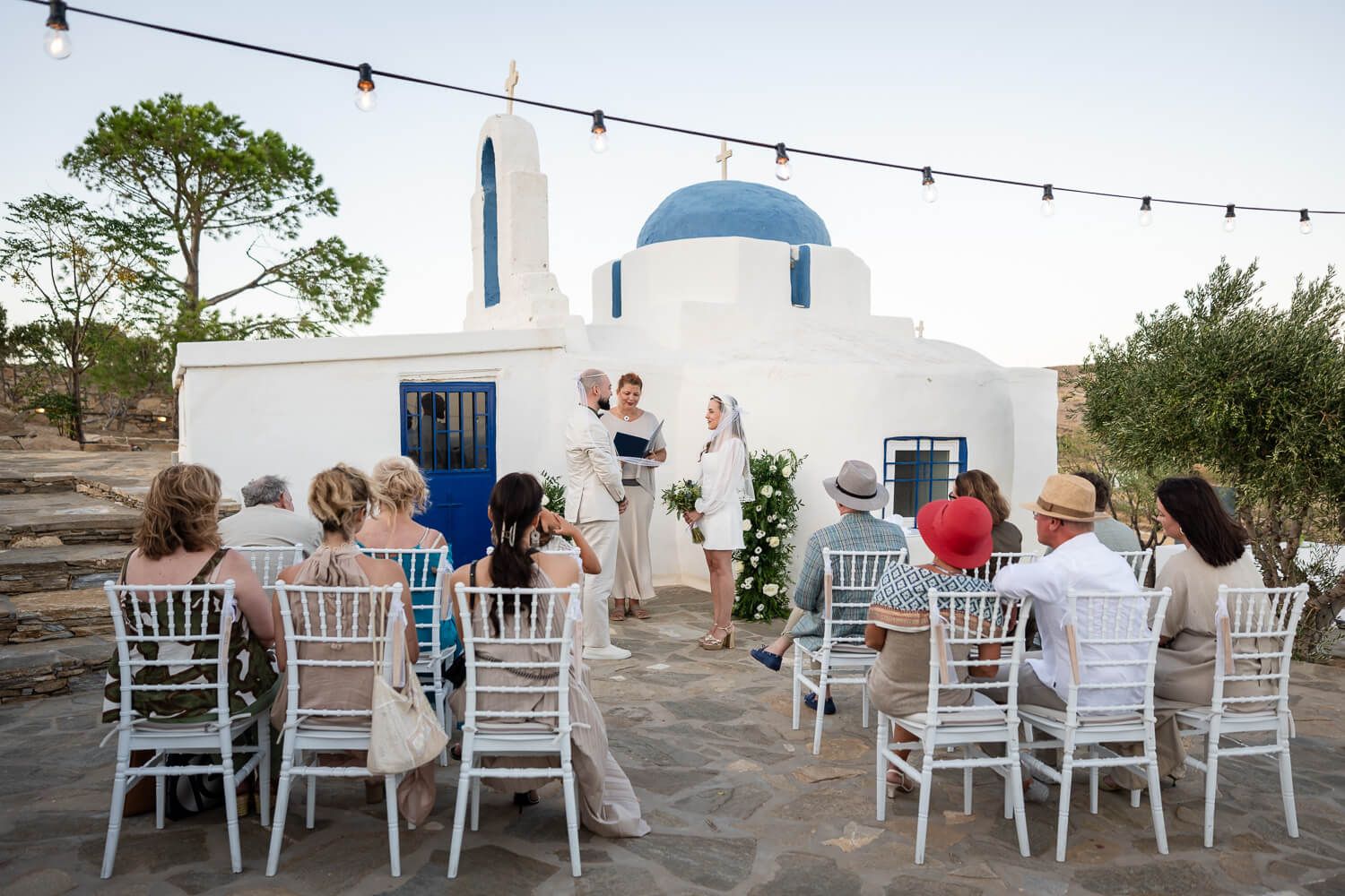 Wide shot of the beautiful micro wedding ceremony overlooking the Aegean Sea