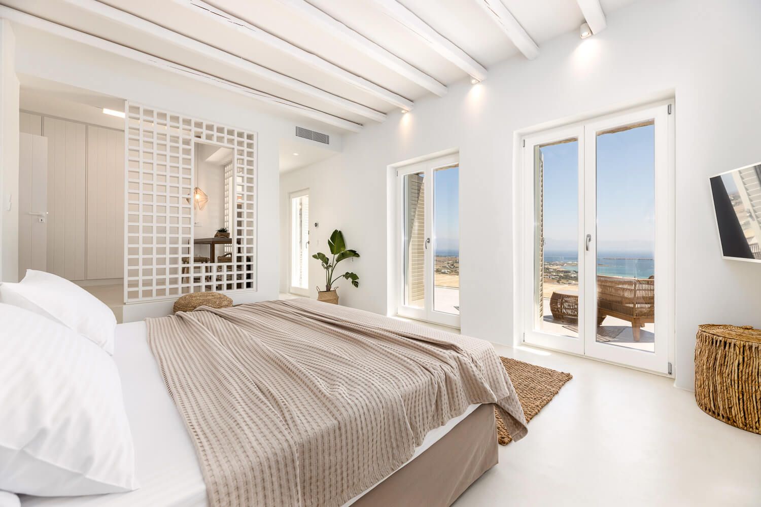 Inviting master bedroom flooded with natural Mediterranean light