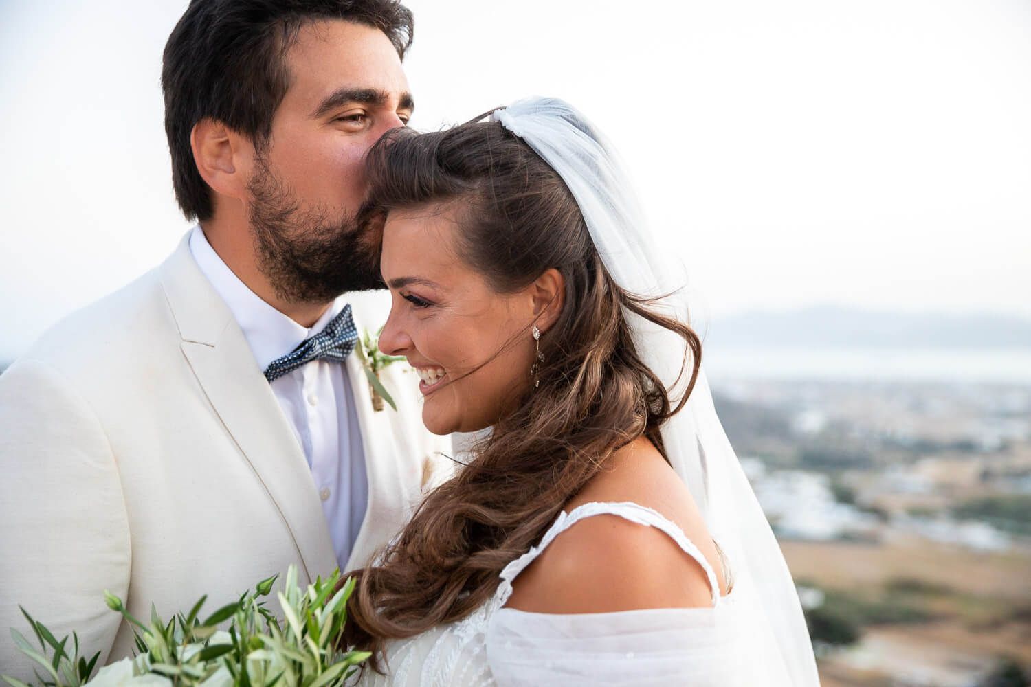 Romantic couple photos in Paros landscape by wedding photographer