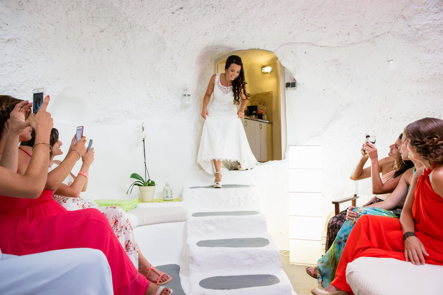 Spanish bride with bridesmaids having fun during preparation