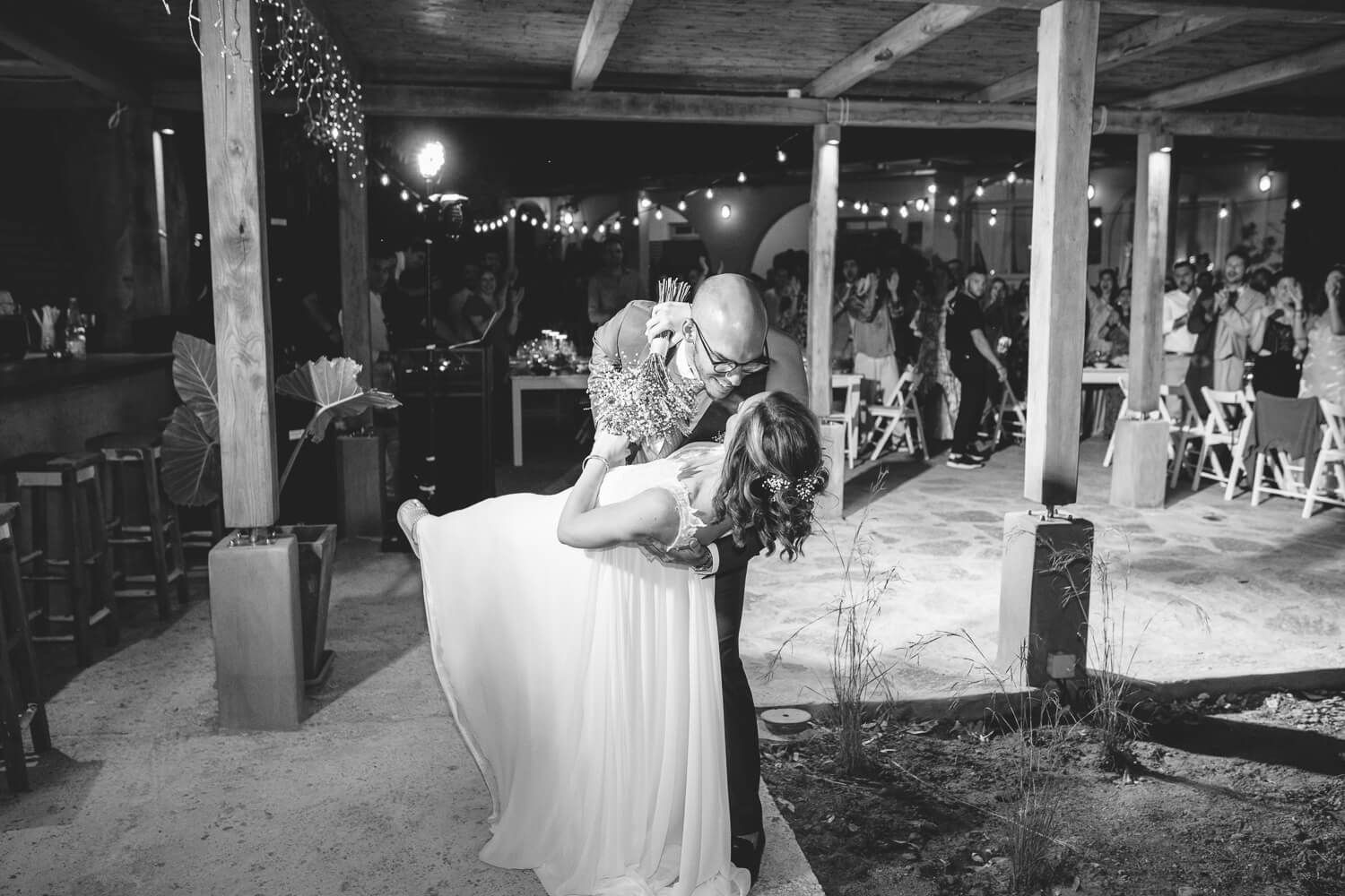 Dimitris and Ioanna sharing a first dance under the stars at Rebel Bar Paros