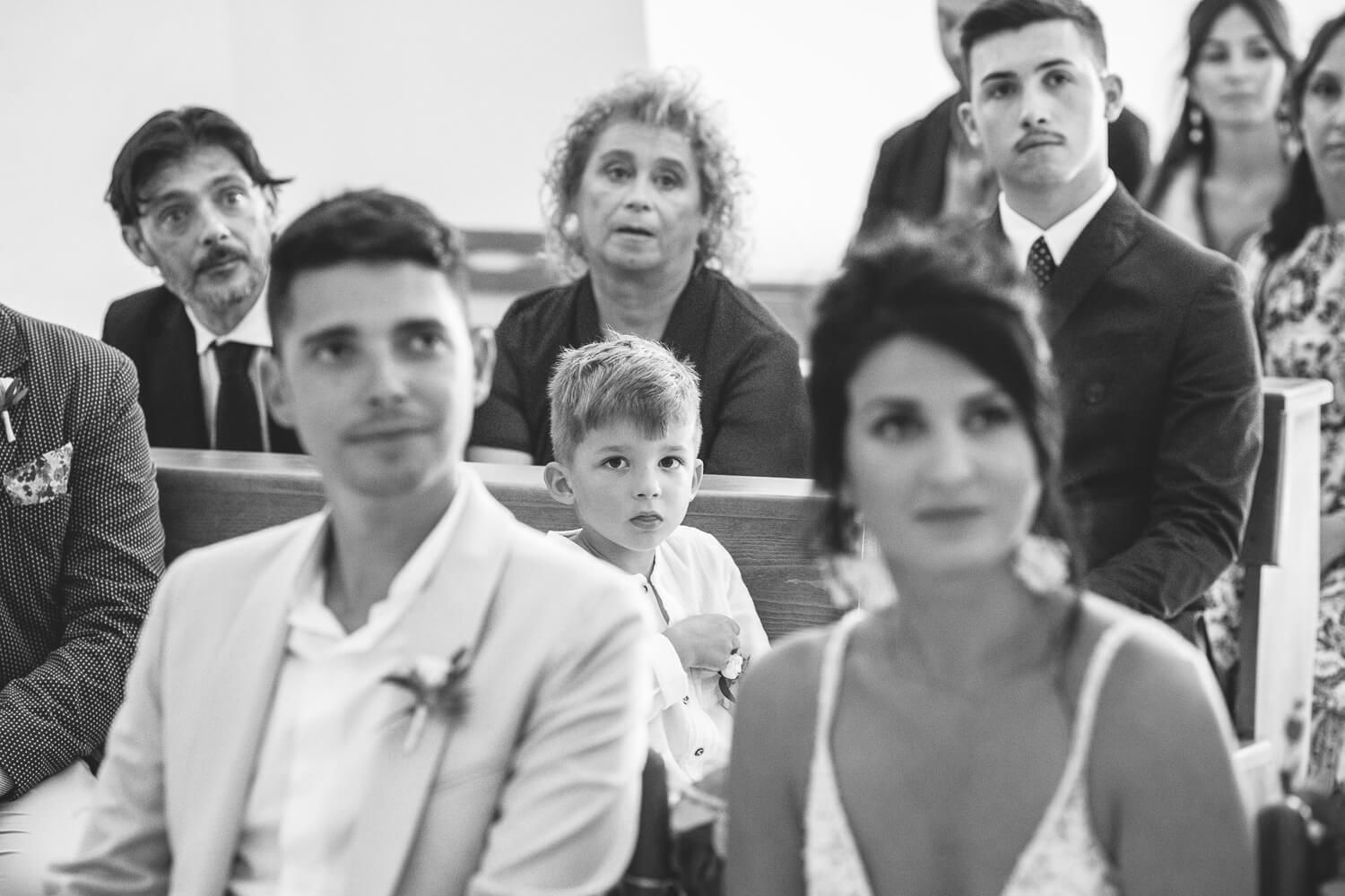 Emotional moment of the bride's son looking attending the wedding ceremony