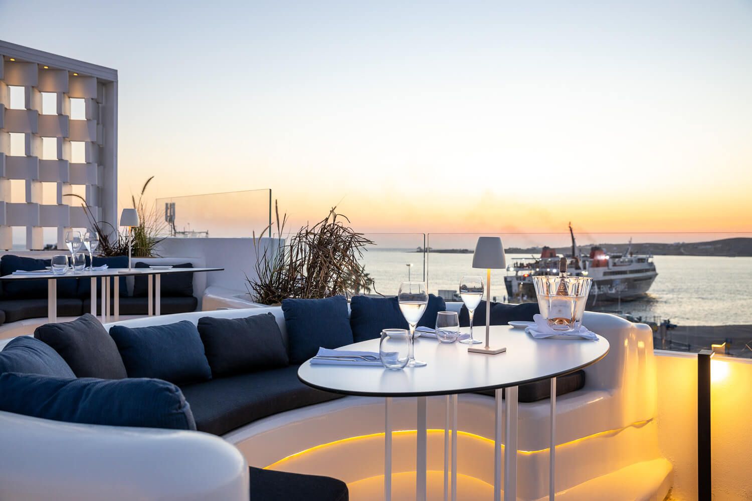 Sunset colors reflecting on premium tableware and glasses