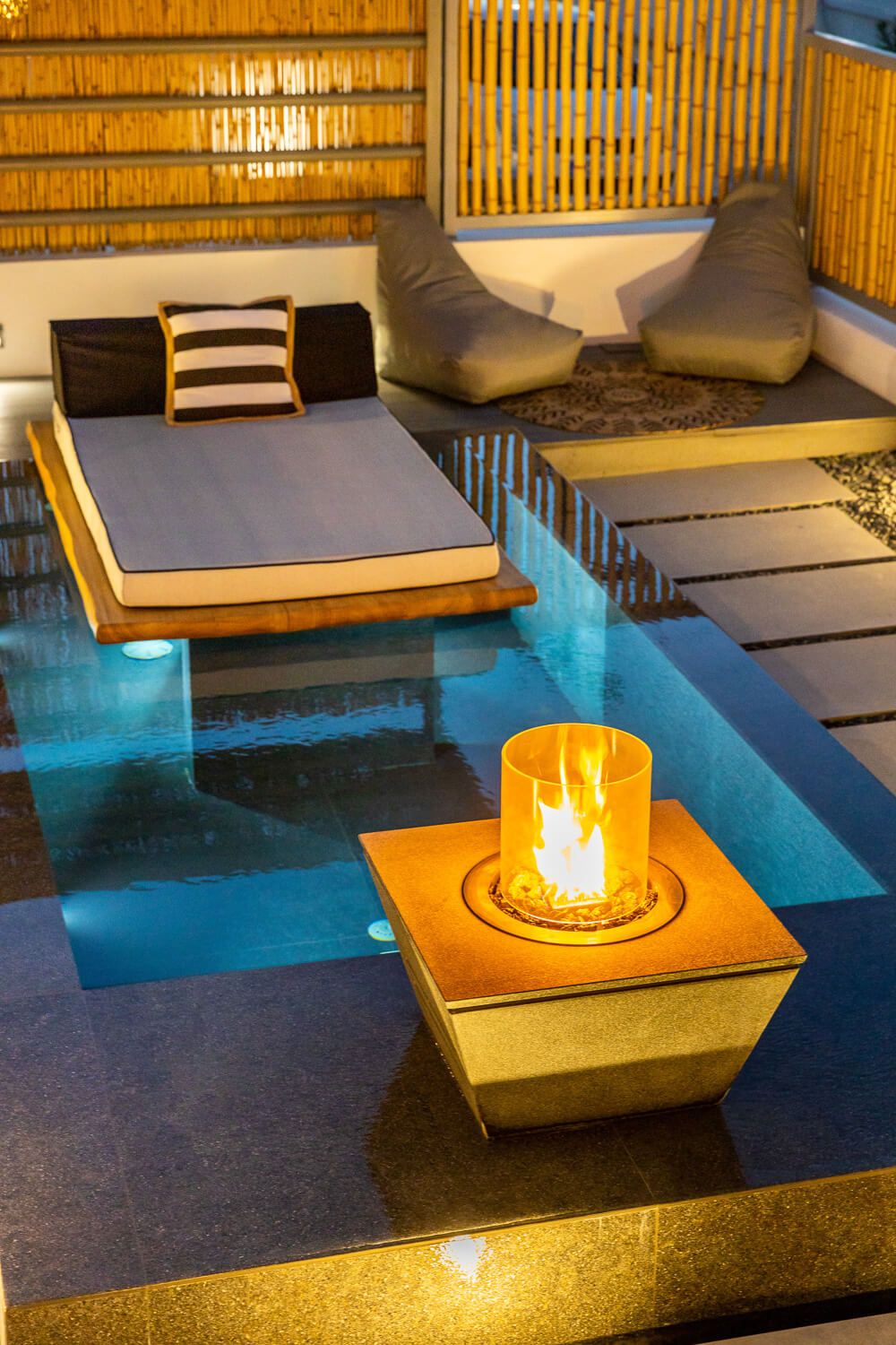 Golden hour reflections highlighting contemporary Cycladic design