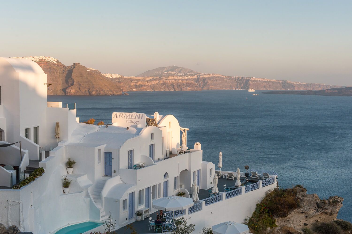Architectural framing emphasizing the dramatic caldera drop