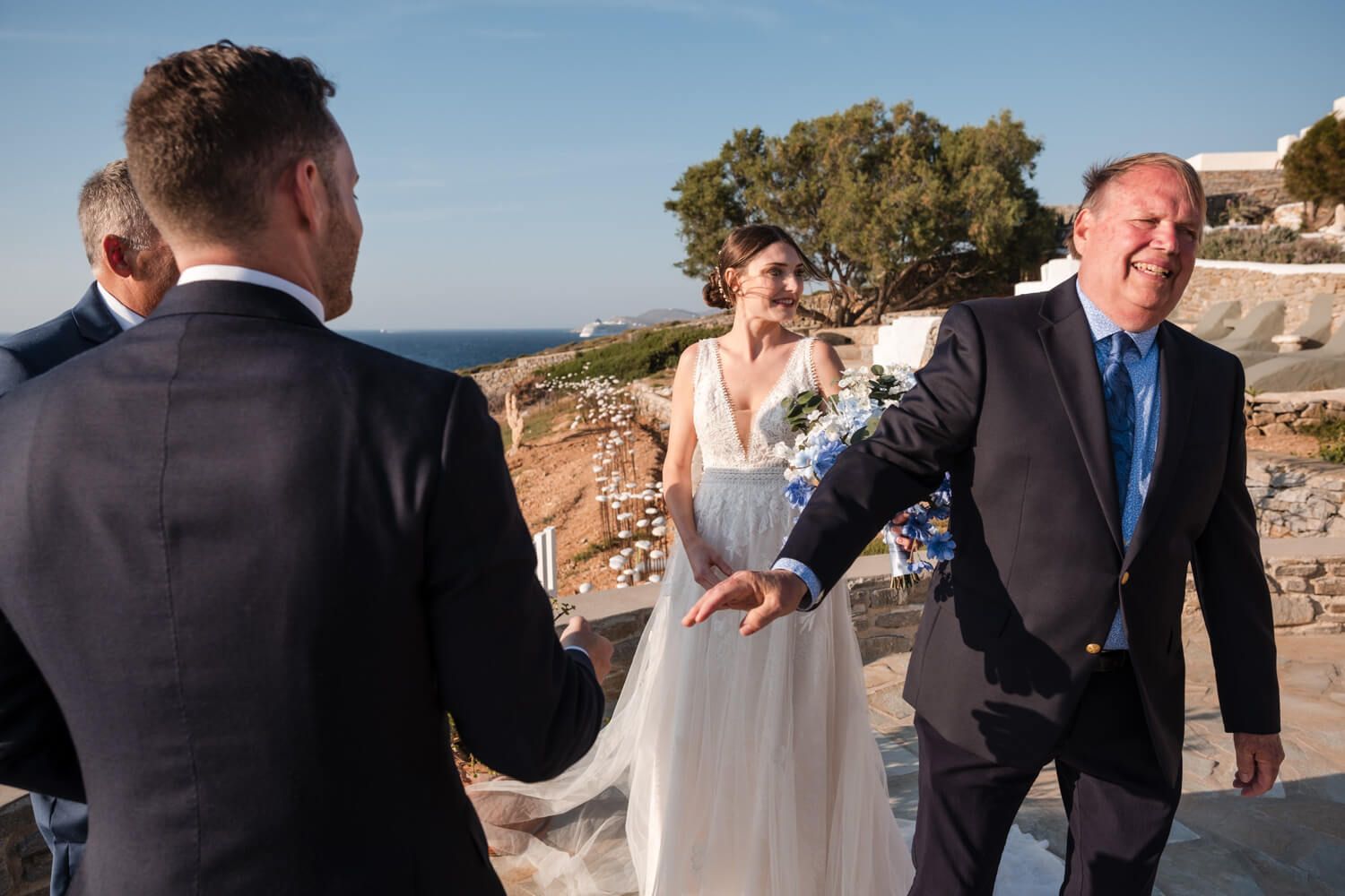 Bride Lizzy walking to her symbolic wedding ceremony in Greece