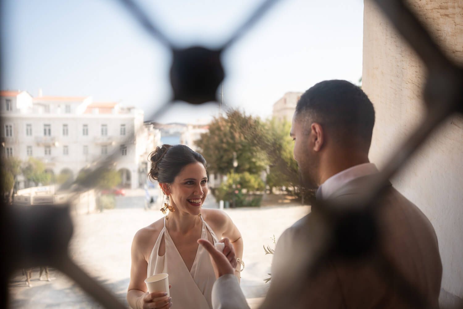 The couple shares a quite moment before their wedding ceremony at Ermoupolis Town Hall