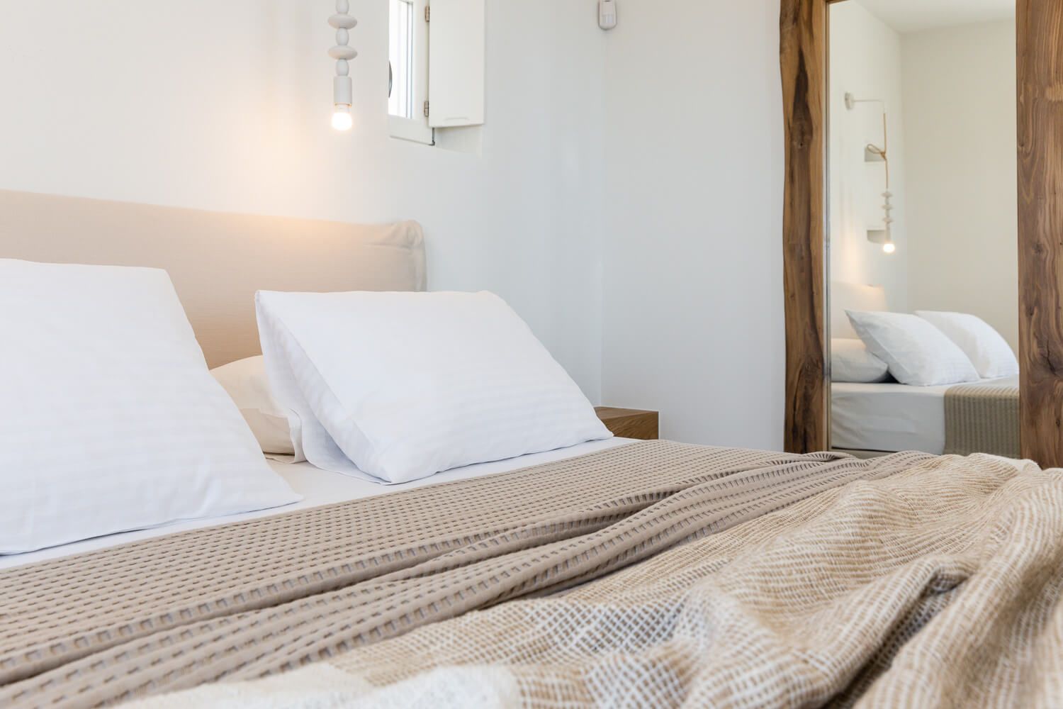Distinctive bedroom styling focusing on warmth and simplicity