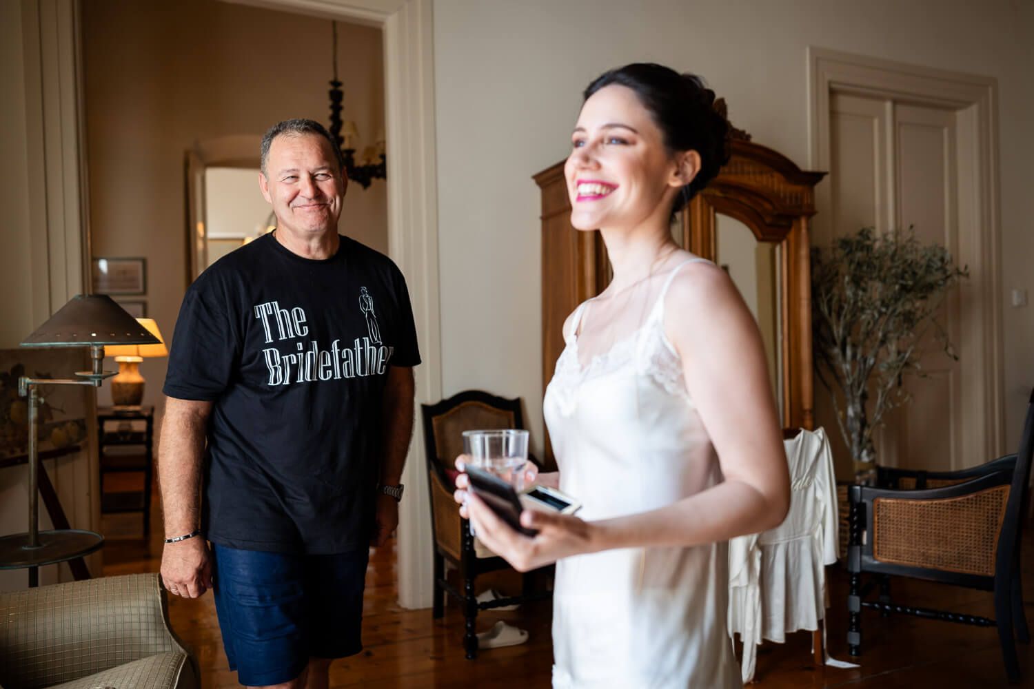 Natural light illuminating the bride in a historic Ermoupolis home