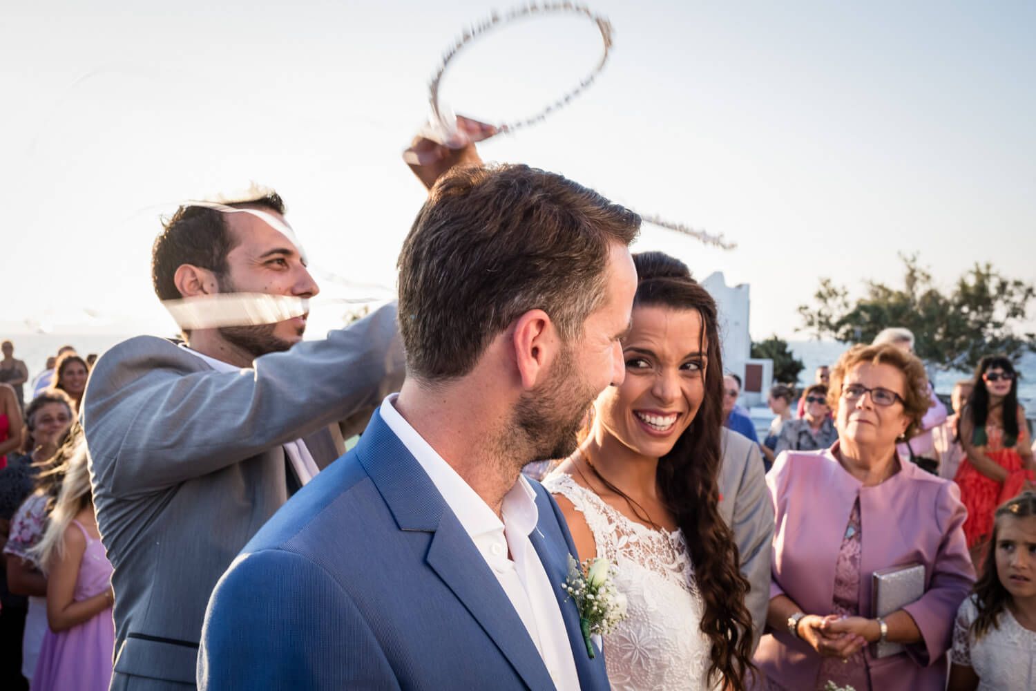 The priest crowning the couple - Traditional Orthodox wedding