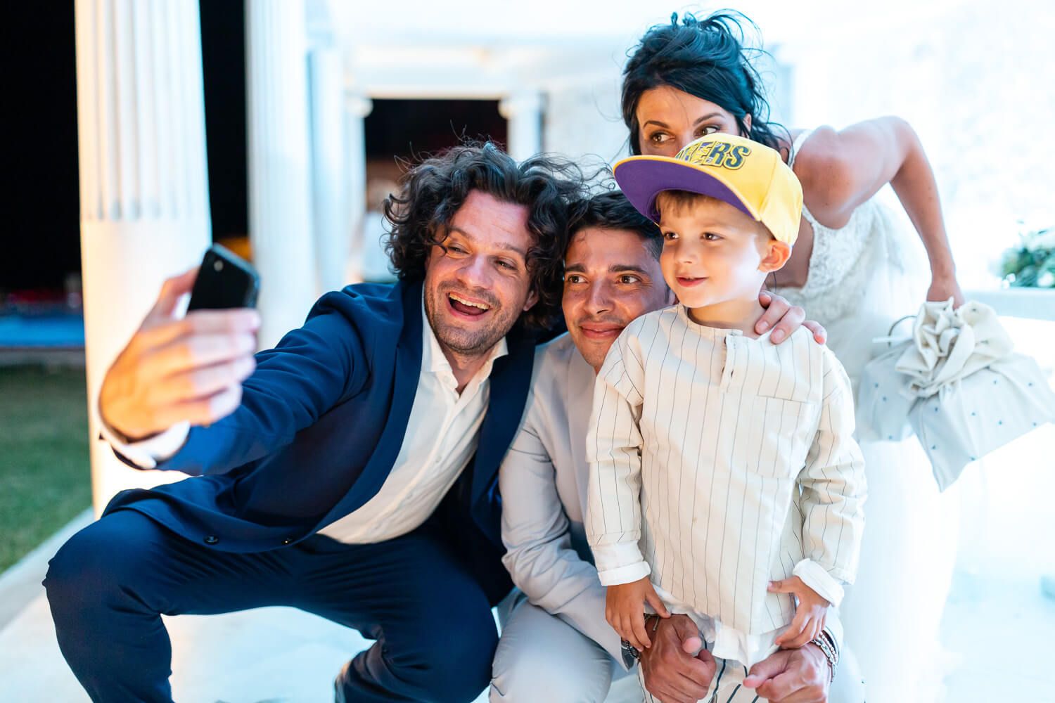 Candid shot of the couple being photographed during the wedding speeches