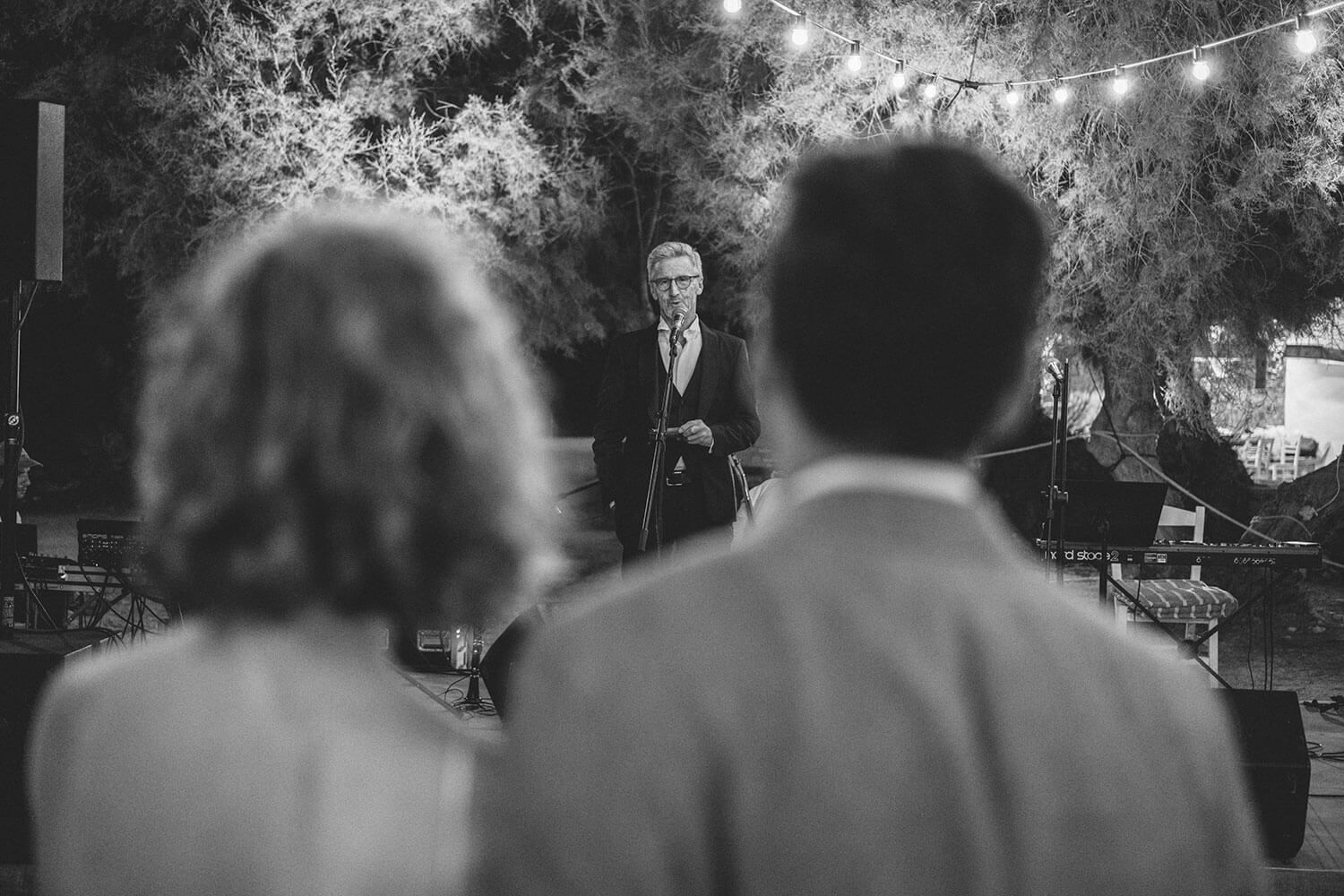 Emotional wedding speeches at a beachfront dinner in the Cyclades