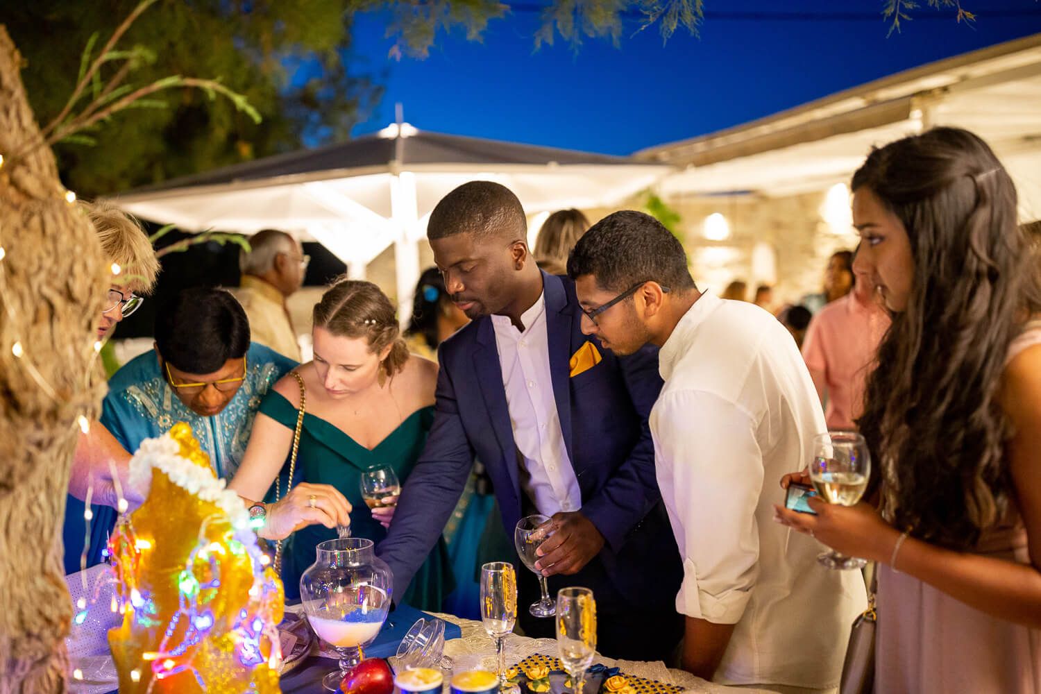Multicultural wedding dinner setup right by the sea in Greece