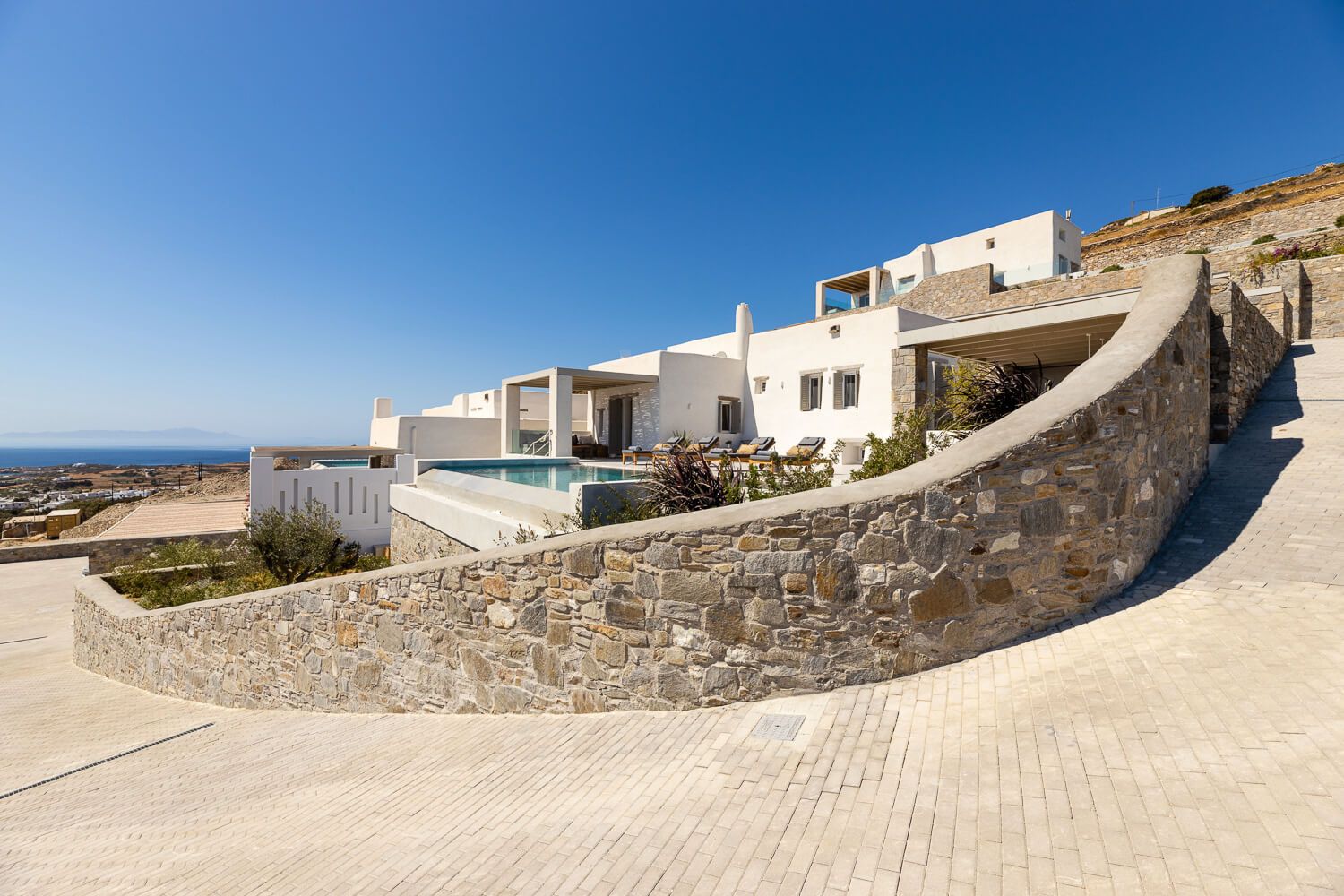 Multi-level exterior design tailored for absolute privacy in a Paros property