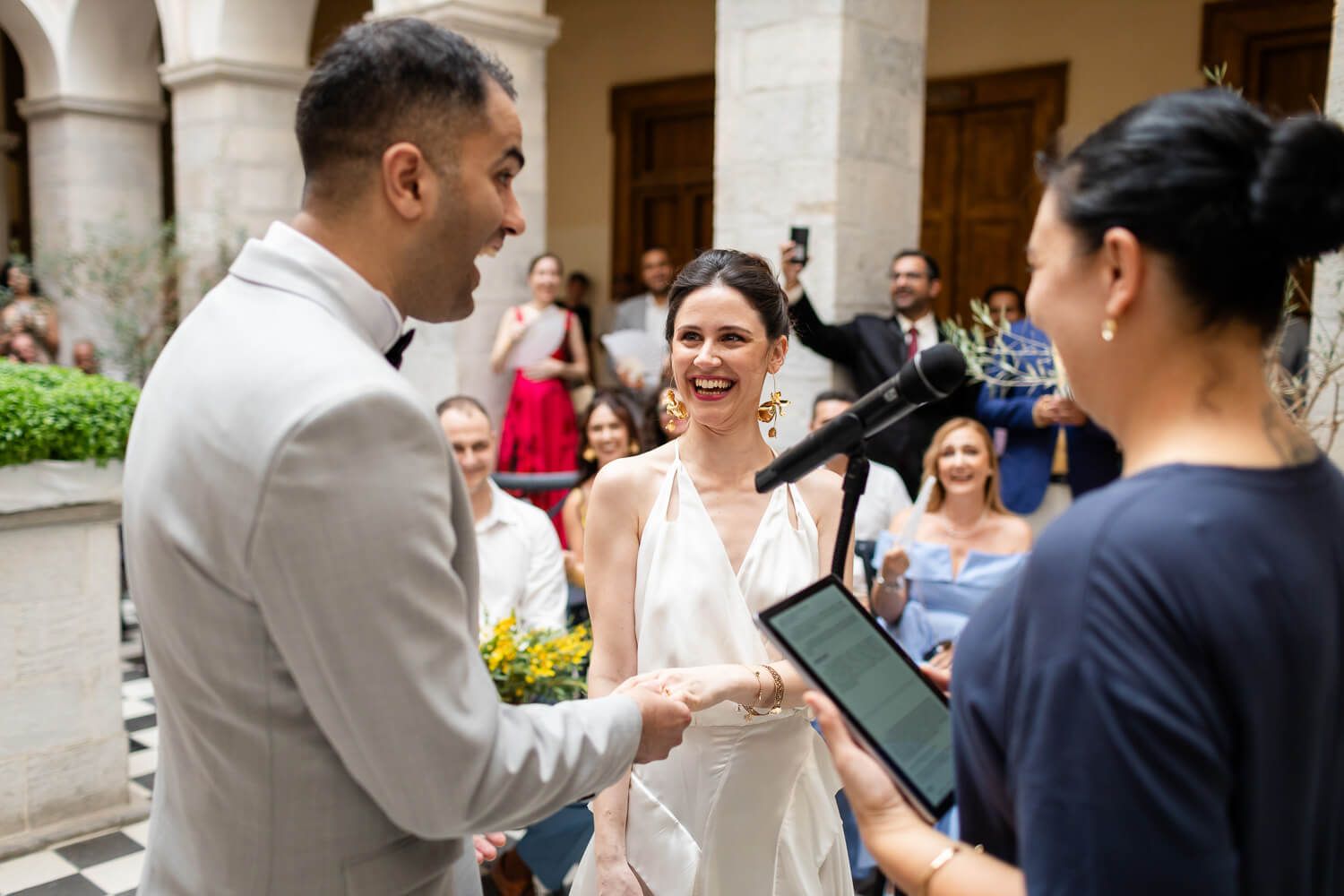 Dimitra and Akshay exchanging rings in Ermoupolis