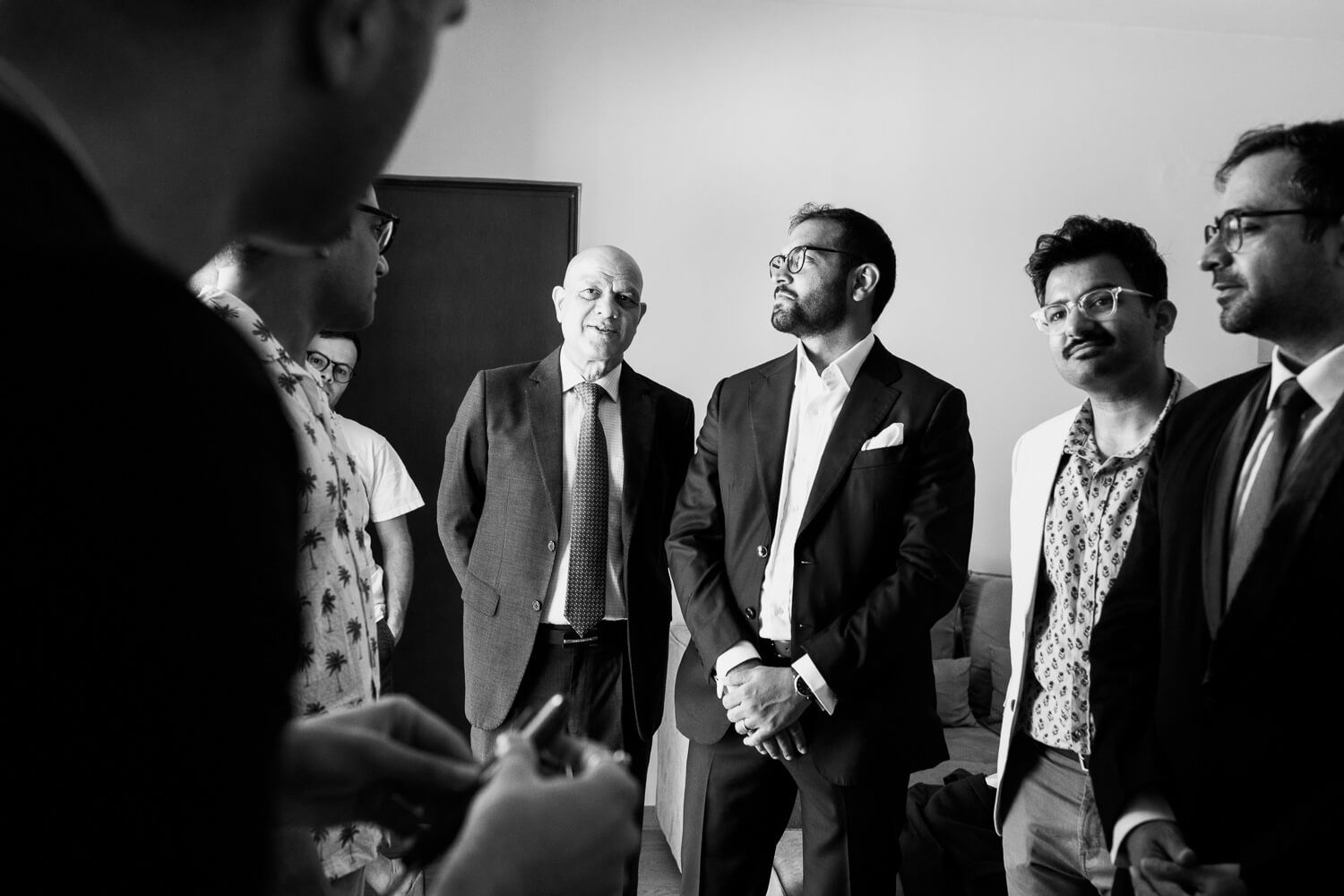 Candid groomsmen portraits by a destination wedding photographer