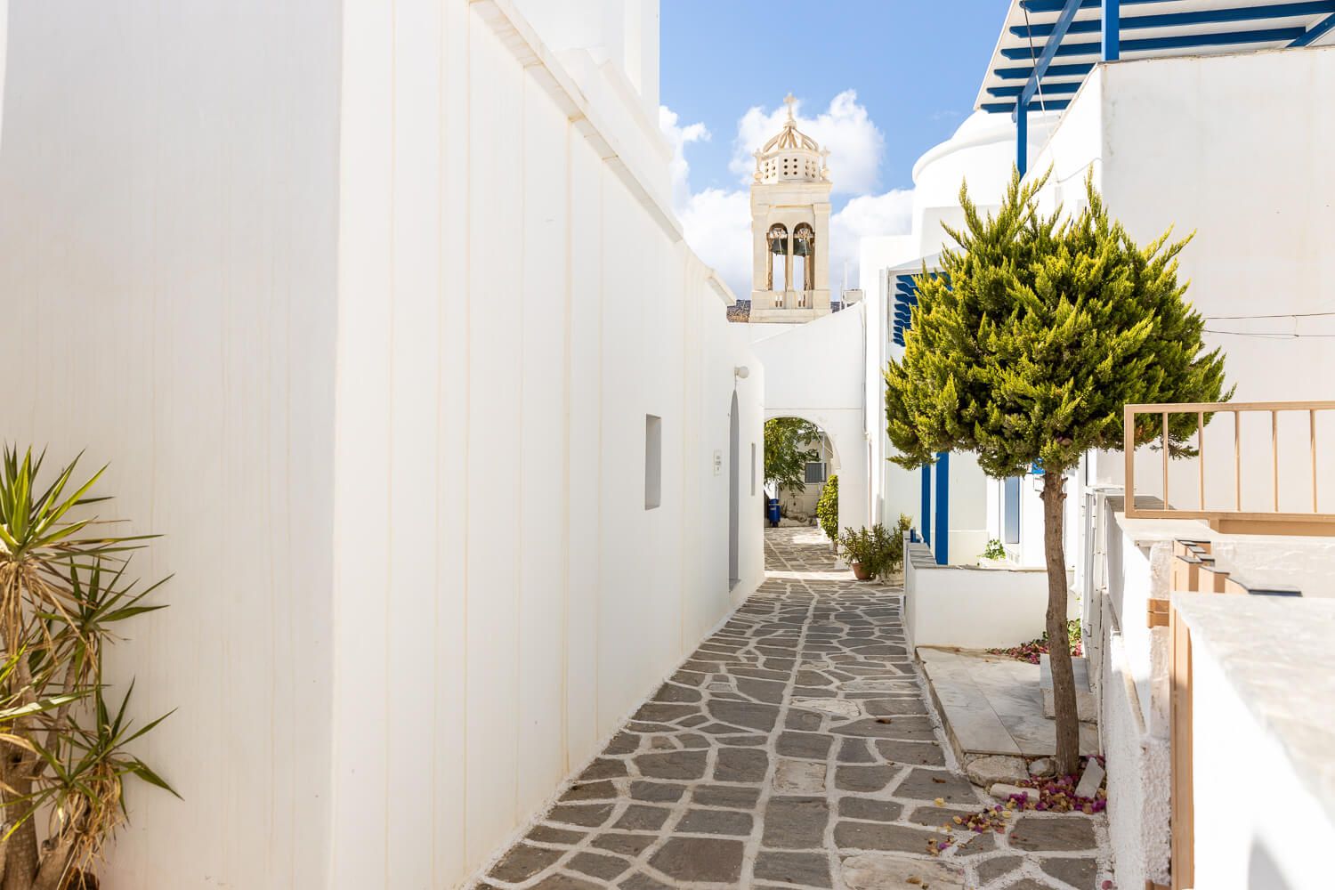 Narrow stone alleys surrounding a historical Cycladic property