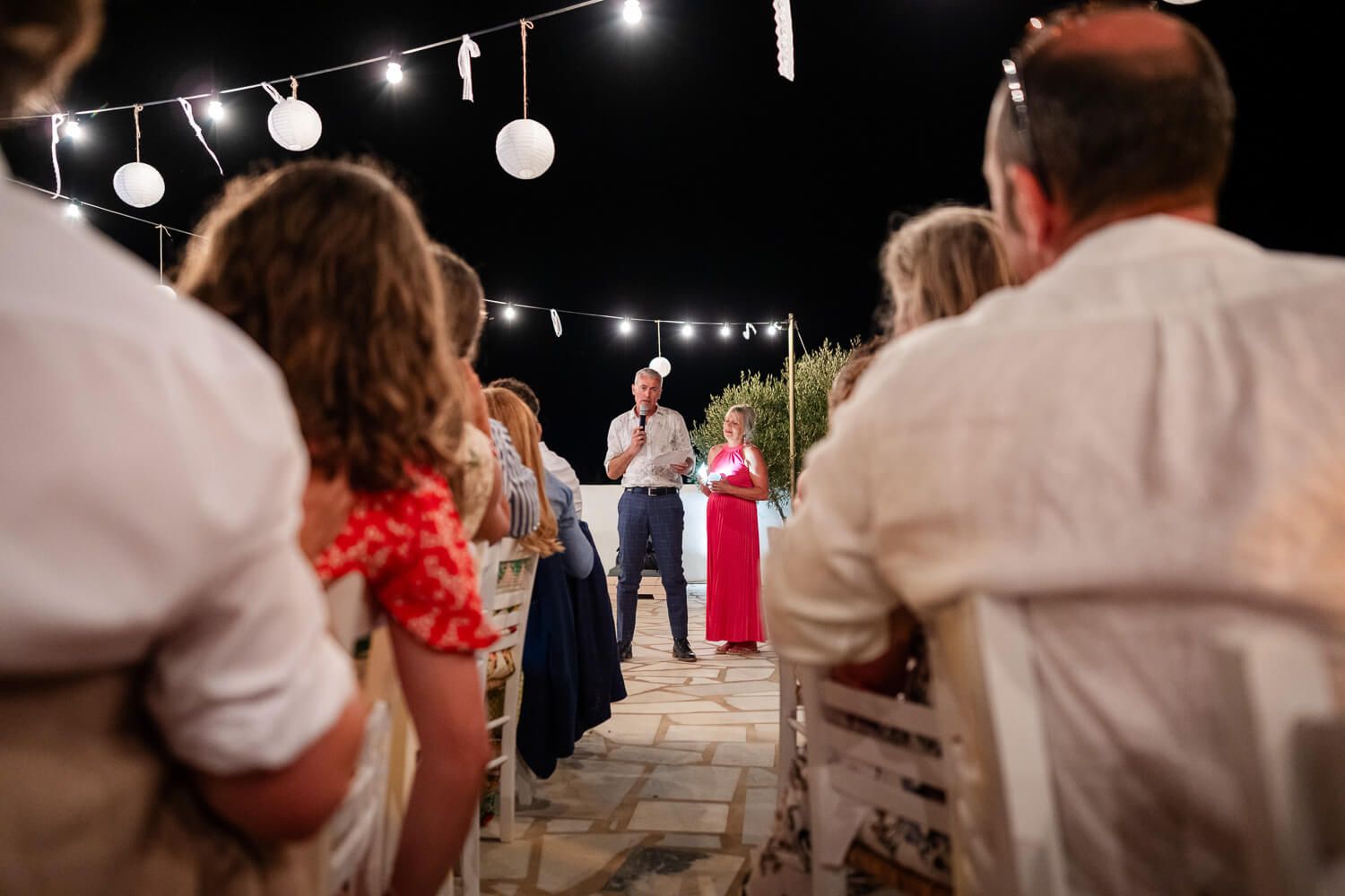 Best man giving a hilarious wedding speech by the pool in Ambelas