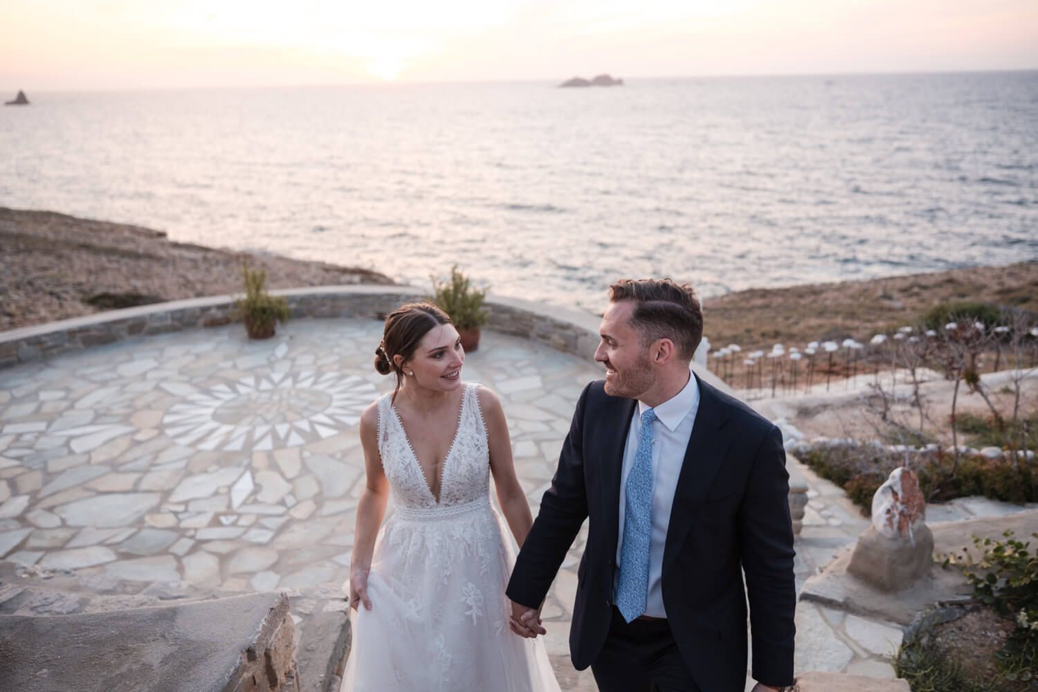 Joyful newlyweds walking together after their symbolic ceremony