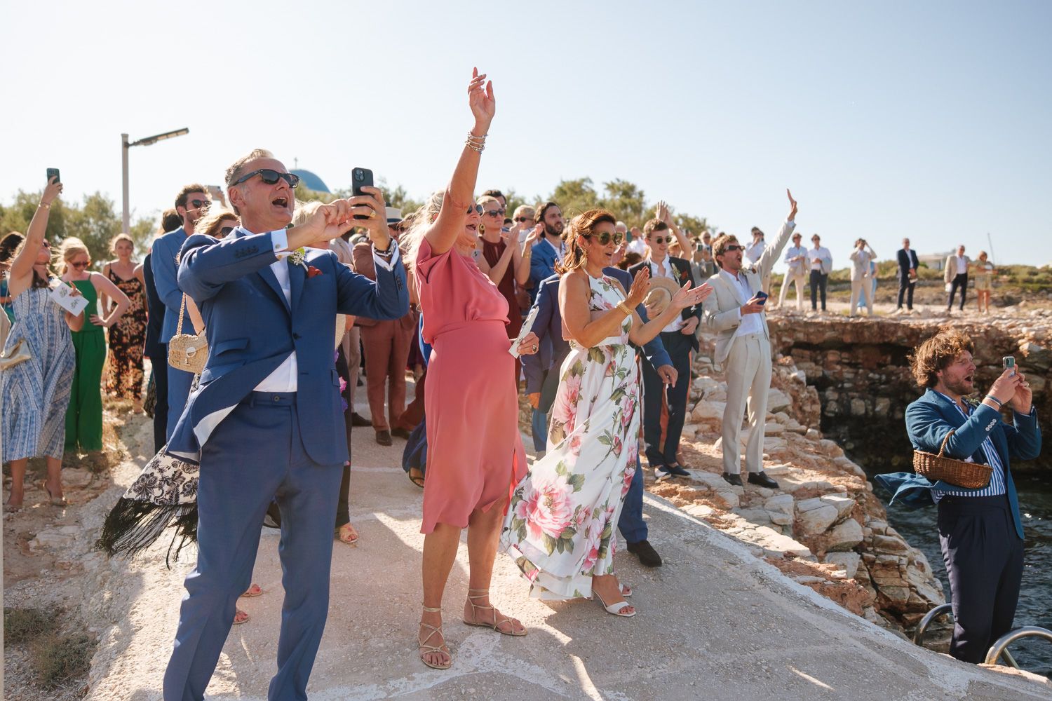 Guests waiting at the pier for the bride - Paros wedding