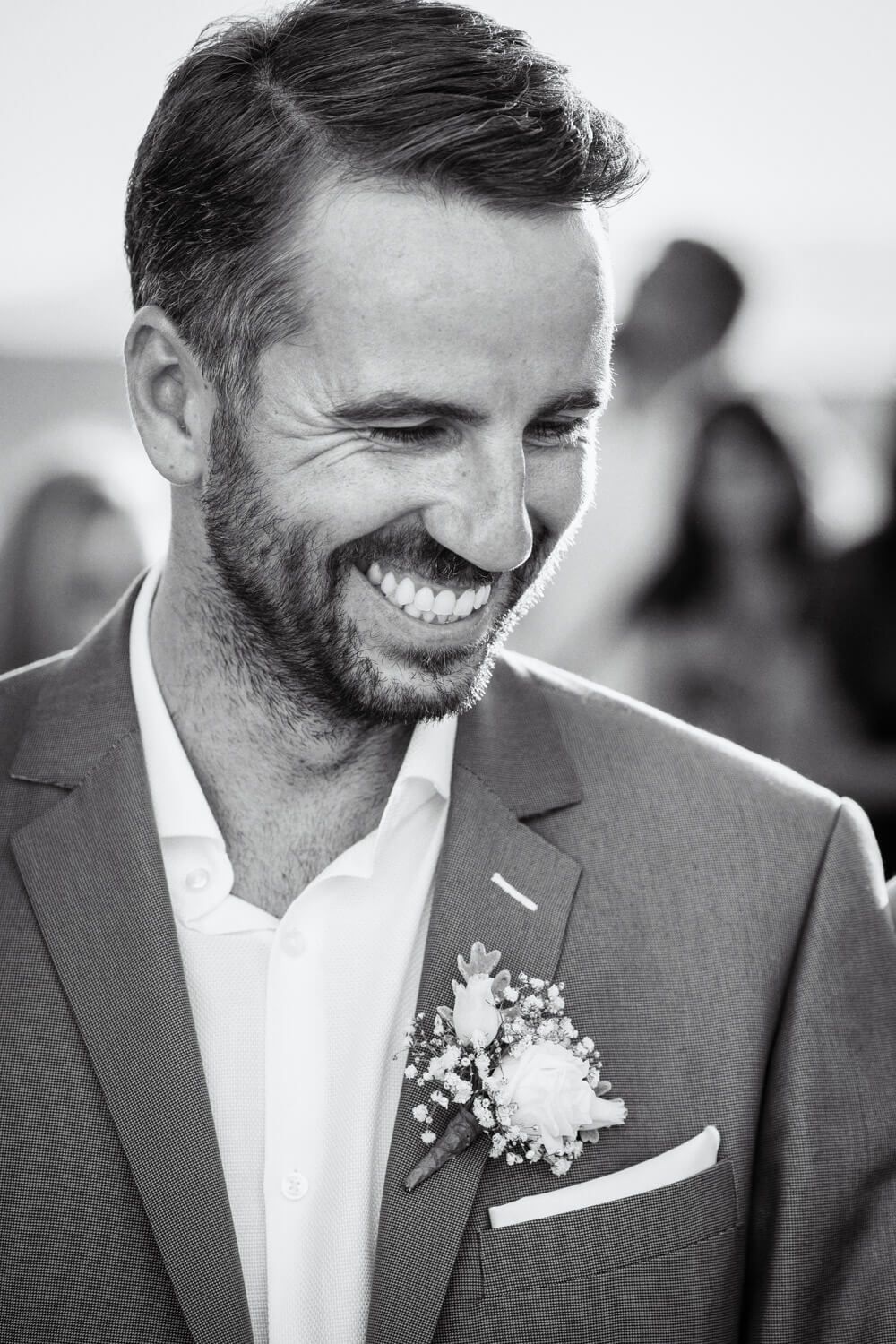 Portrait of groom during a Wedding ceremony at Agios Konstantinos church by the sea in Milos