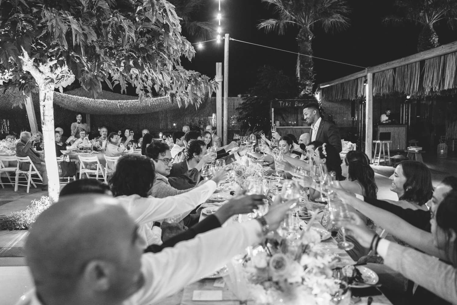 Candid shots of guests celebrating at a grand wedding in Greece