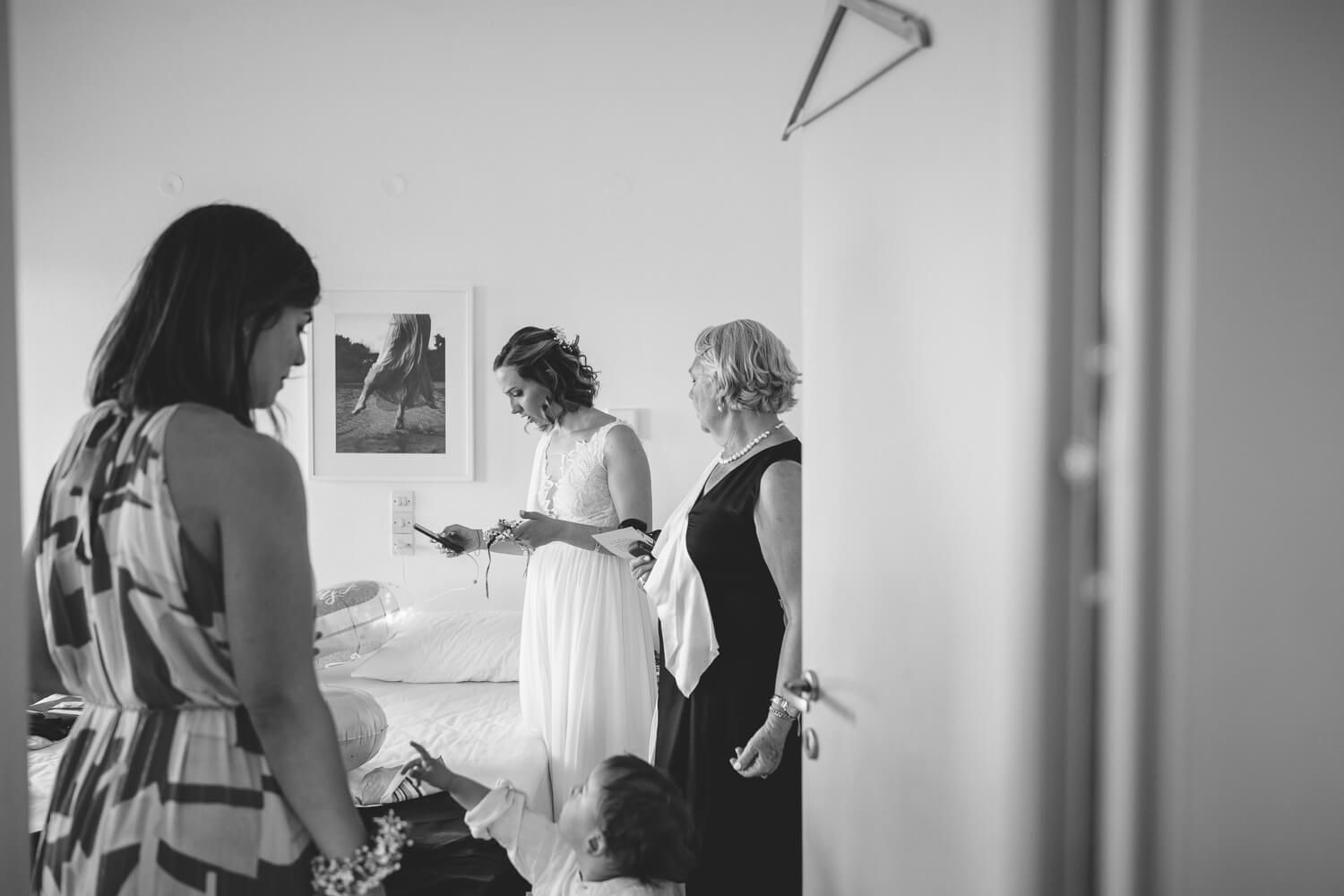 Documentary wedding photography of bridal getting ready for her wedding in Golden Beach Paros