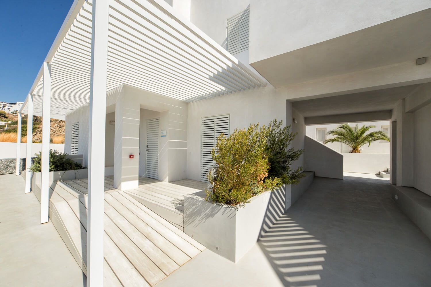 Minimalist architecture blending with the vibrant Aegean landscape