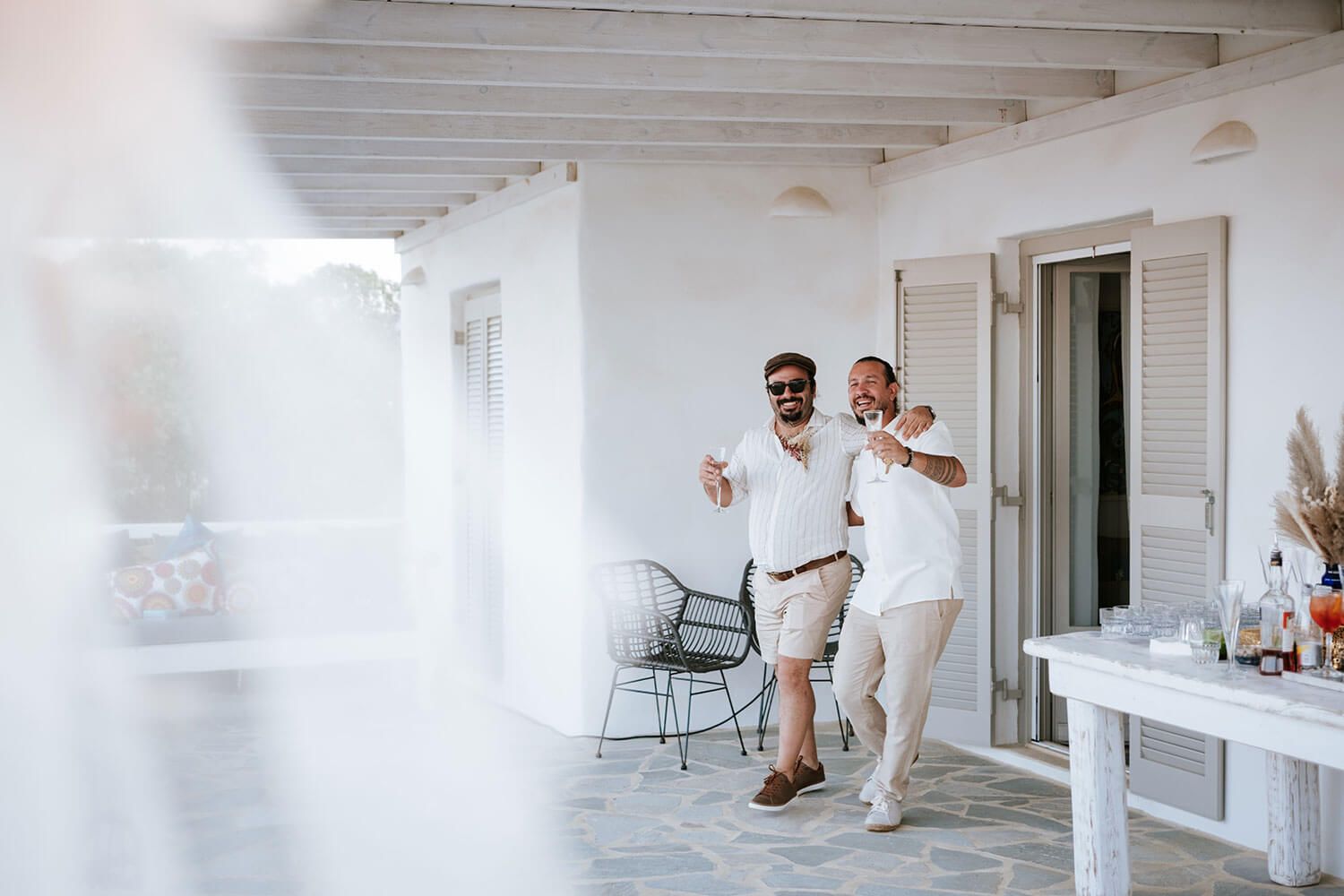 Groom Rady walking down the aisle at his Greek island wedding