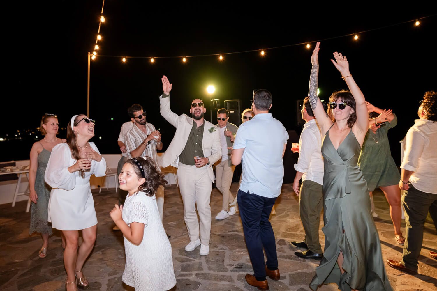 DJ playing international hits while guests dance and celebrate at The Secret View
