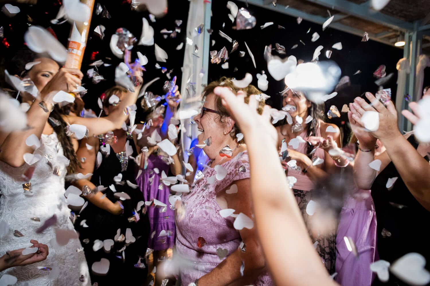 Spanish and Greek guests dancing together - Multicultural wedding