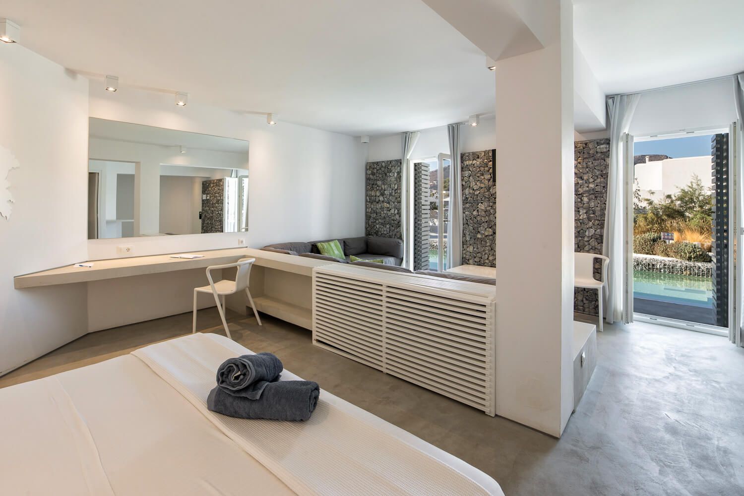 The pristine environment of a modern Ios hotel bedroom