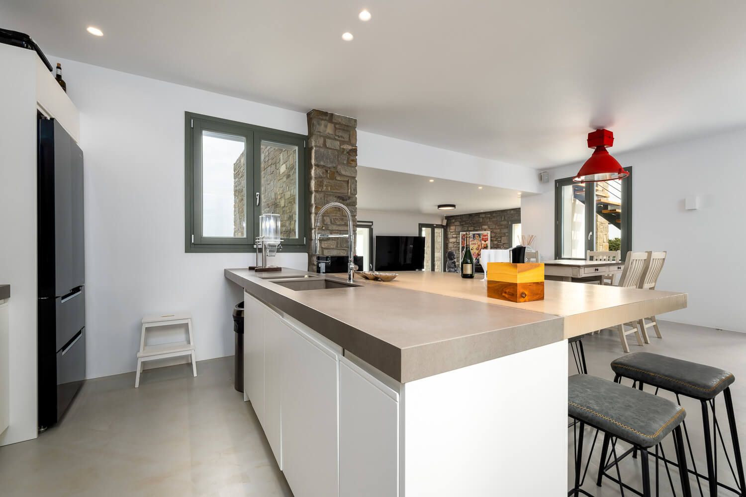 Natural light filling the luxurious kitchen area at Villa Half Moon